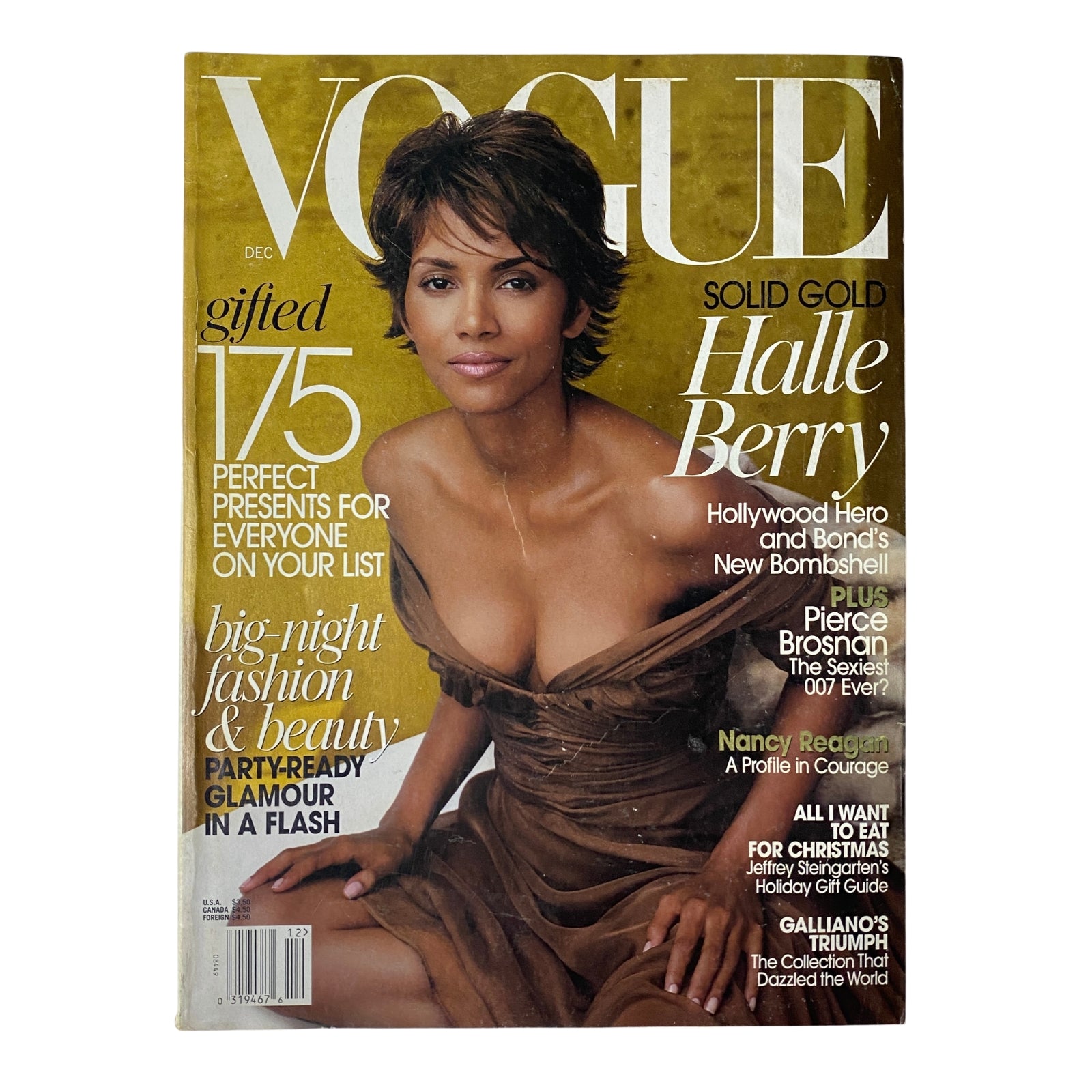 Vogue Magazine December 2002 cover featuring Halle Berry, showcasing the theme 'Solid Gold' with a focus on Hollywood glamour and fashion.