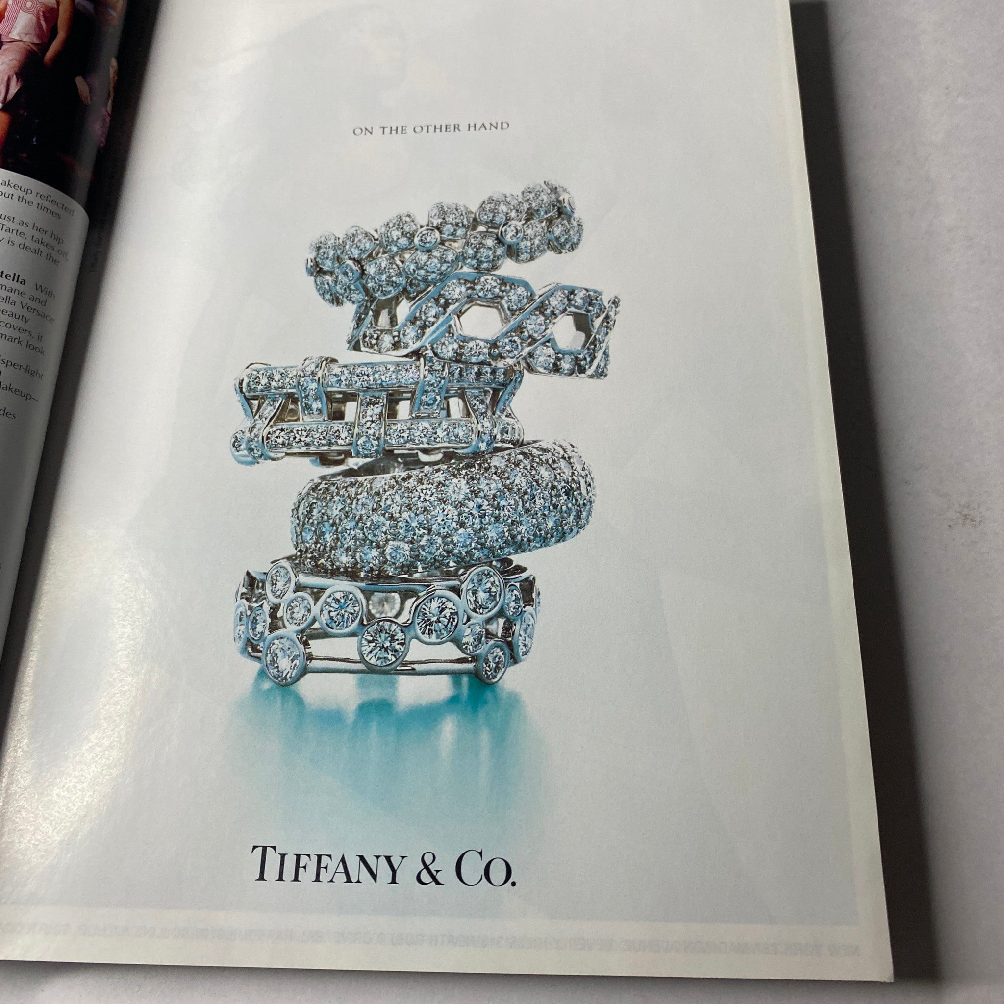 Vogue Magazine March 2002 Gwyneth Paltrow Cover No Label featuring an advertisement showcasing luxurious Tiffany & Co. jewelry, highlighting an elegant arrangement of sparkling rings.