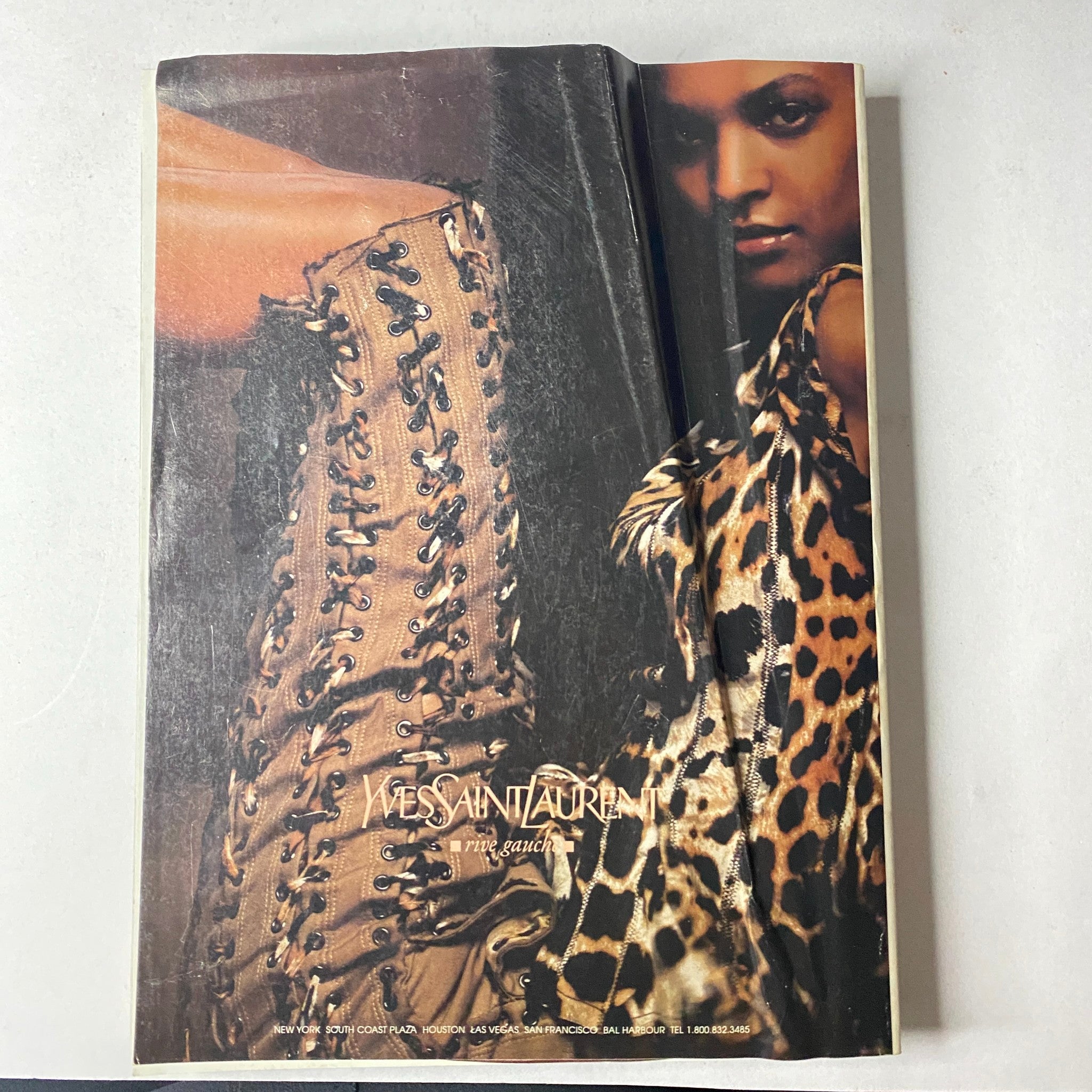 Vogue Magazine March 2002 Gwyneth Paltrow Cover No Label featuring a striking advertisement for Yves Saint Laurent, showcasing a bold fashion design with a leopard-print aesthetic.