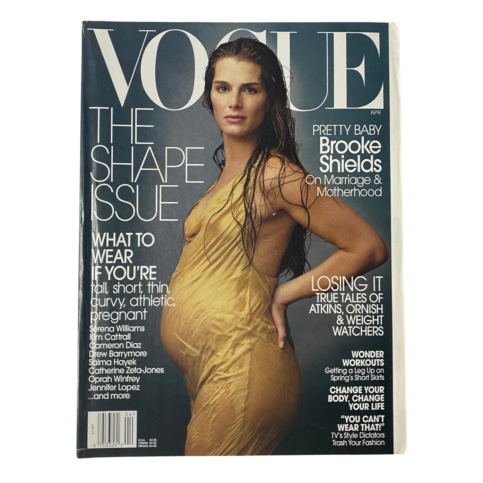 Vogue Magazine April 2003 featuring Brooke Shields on the cover, captured by Annie Leibovitz in a sheer yellow silk dress, highlighting themes of motherhood and fashion.