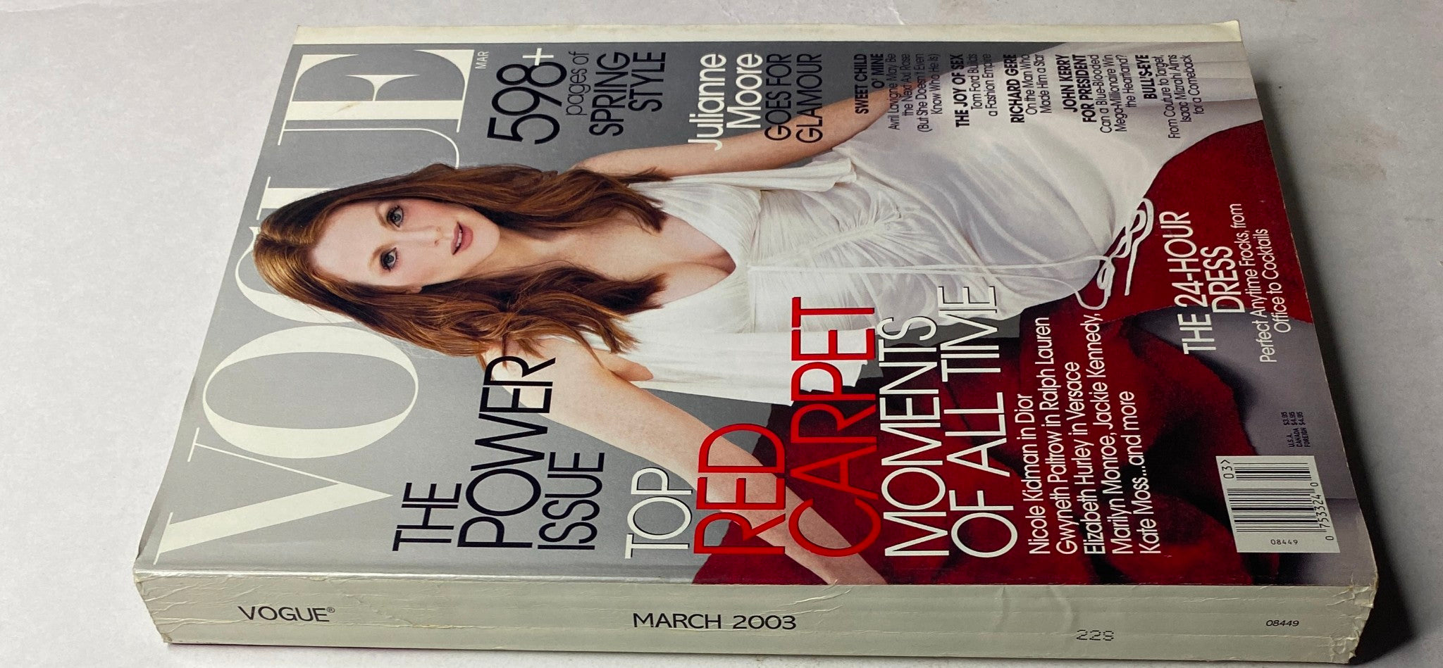 Side view of Vogue Magazine March 2003 with Julianne Moore on the cover. This issue emphasizes the power of red carpet moments and includes articles on women's fashion and style.