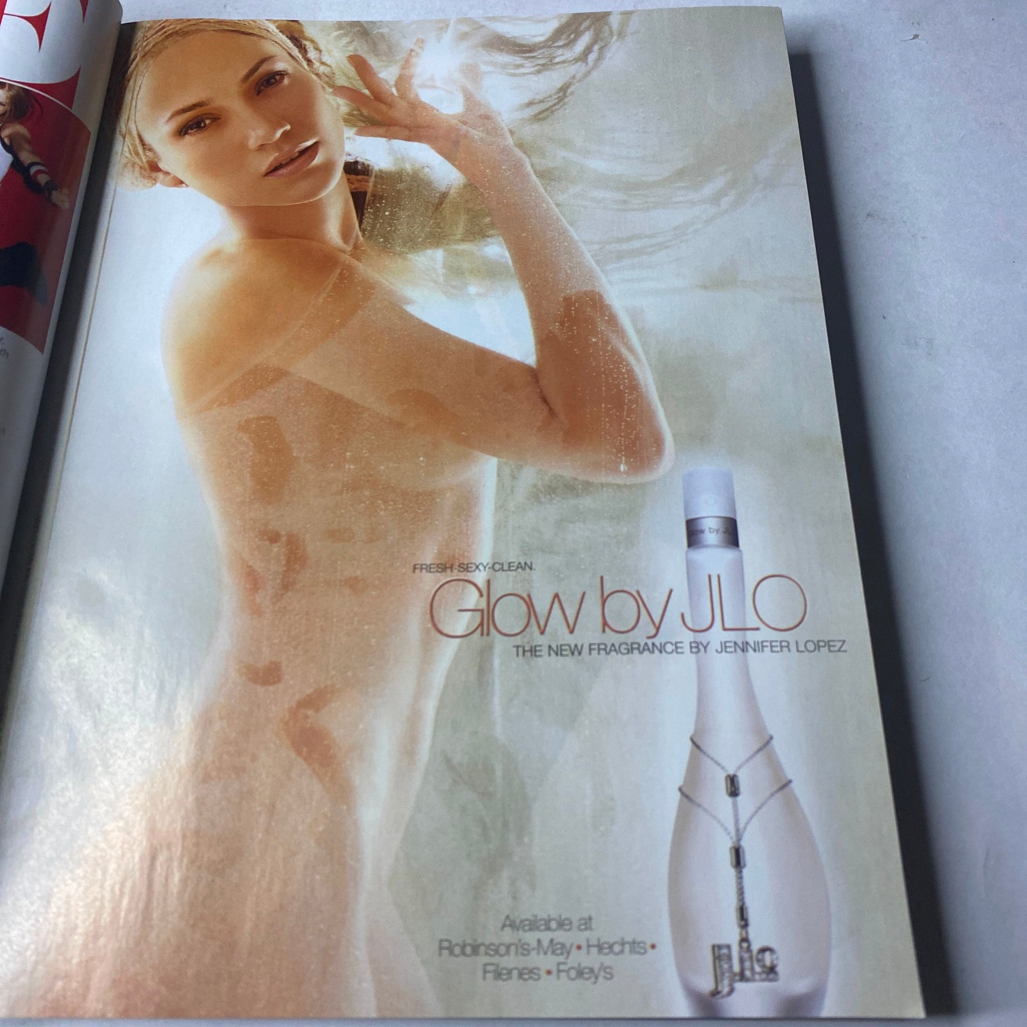 Vogue Magazine March 2003 Julianne Moore Cover No Label VG showcasing an advertisement for Glow by JLO, highlighting Jennifer Lopez's new fragrance.