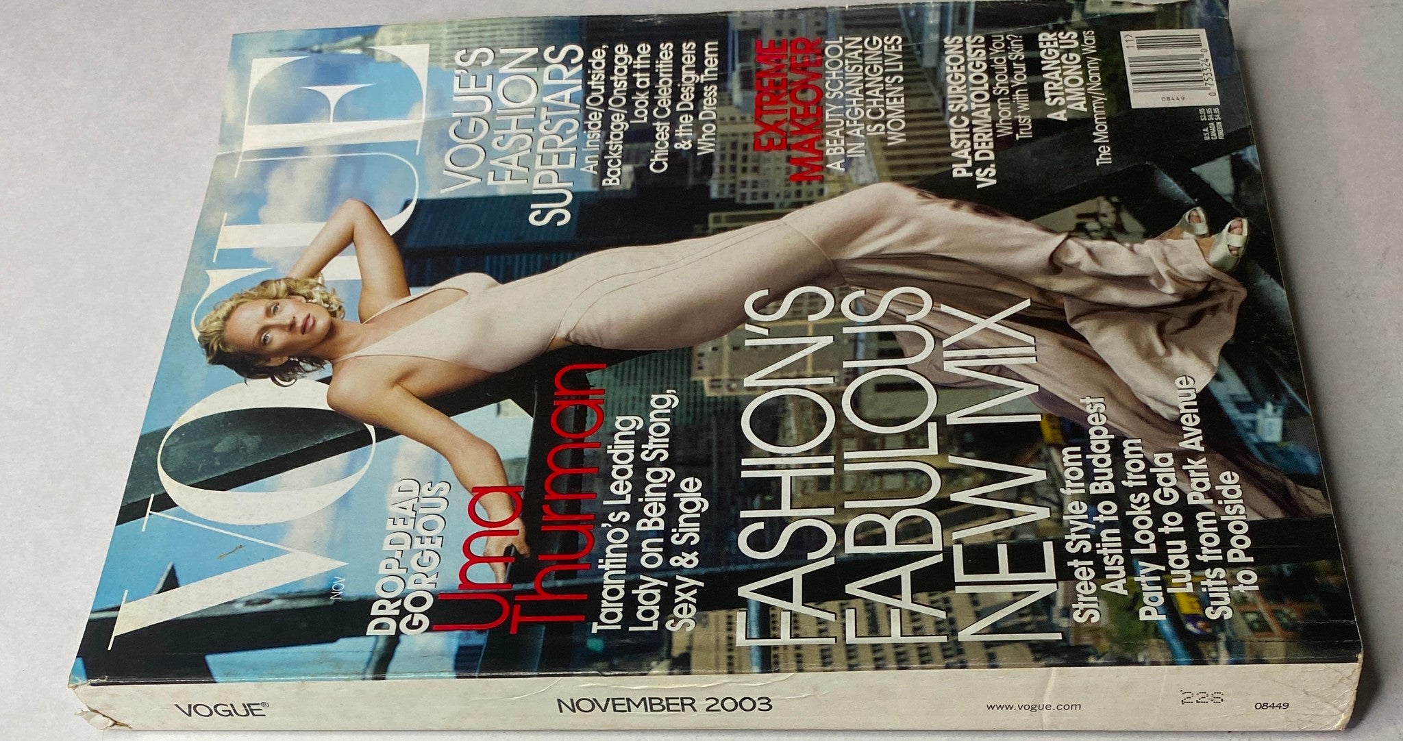 Back cover of Vogue Magazine November 2003 highlighting Uma Thurman's cover story and fashion themes.