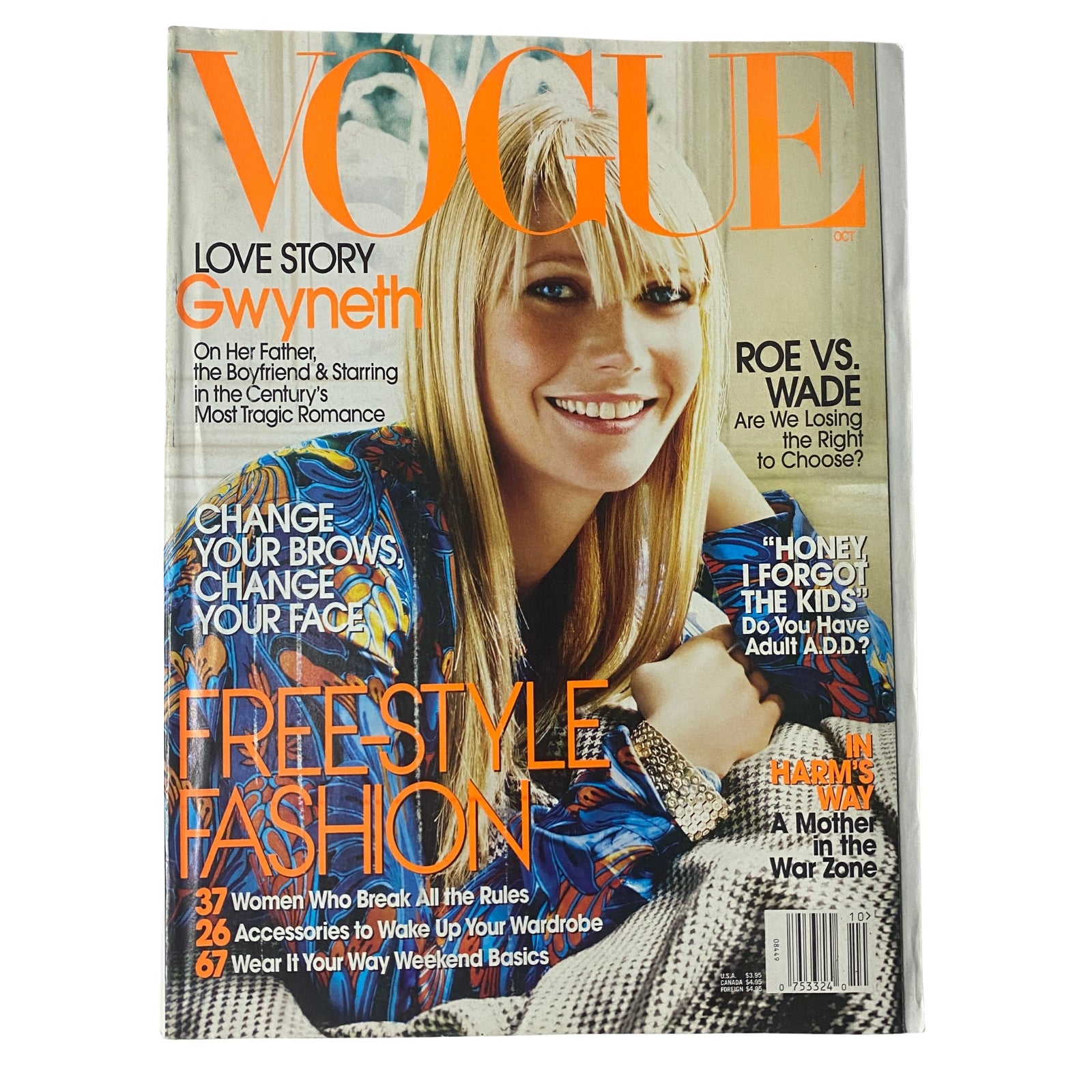 Vogue Magazine October 2003 cover featuring Gwyneth Paltrow styled in a vibrant outfit, highlighting themes of fashion and beauty.