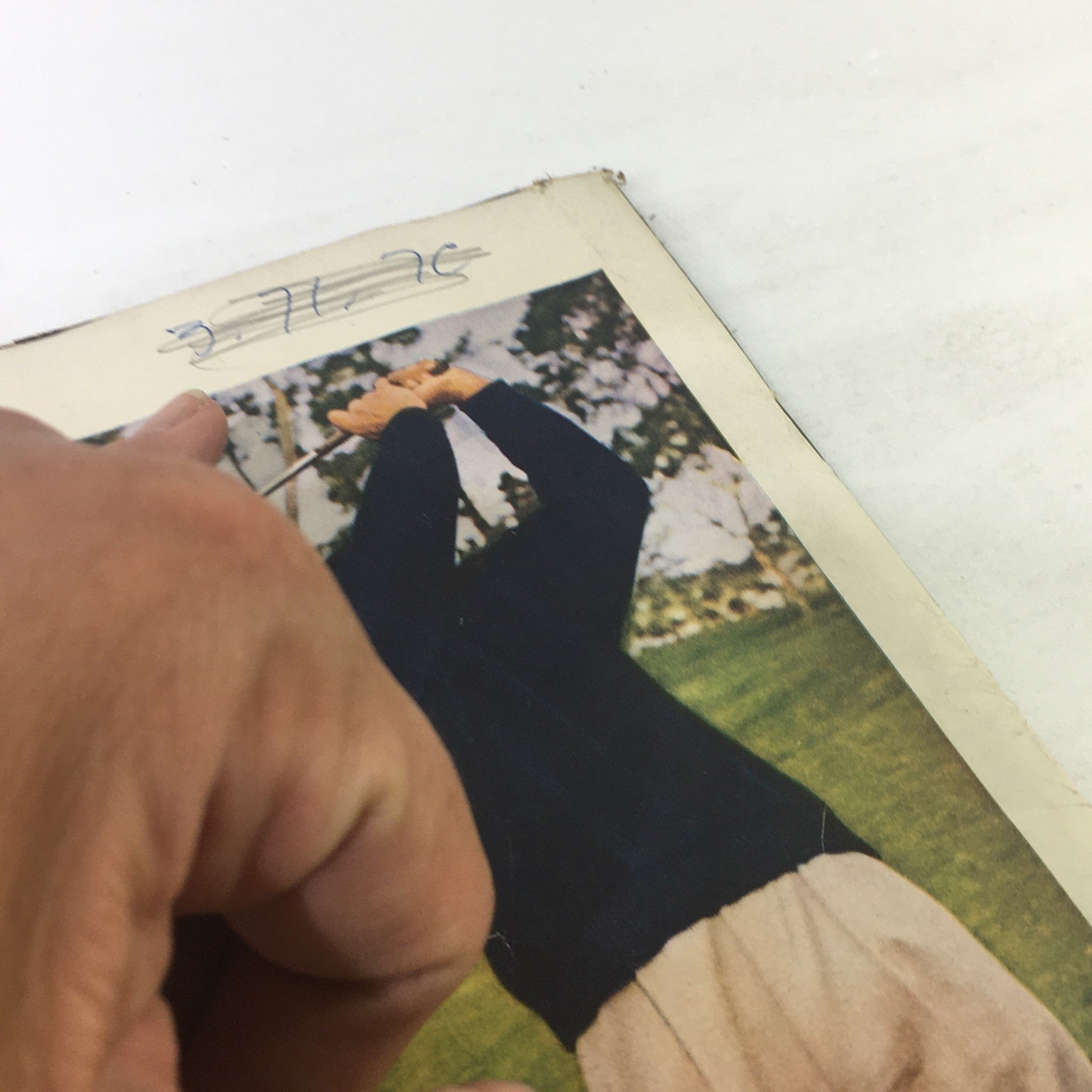 Close-up of a hand pointing at the top of a page in VTG Life Magazine from May 26, 1958, featuring Anti-U.S. Riots Abroad and Assault on Richard Nixon. The image shows the magazine cover partially open, displaying minor wear indicative of its vintage condition.
