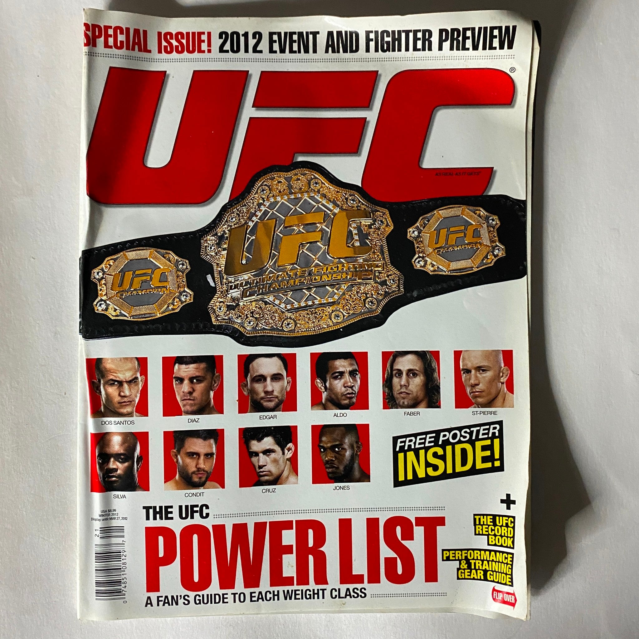 UFC Magazine Power List Special Issue, featuring a detailed preview of UFC events and fighters with a prominent UFC championship belt on the cover, highlighting the sport's top athletes.