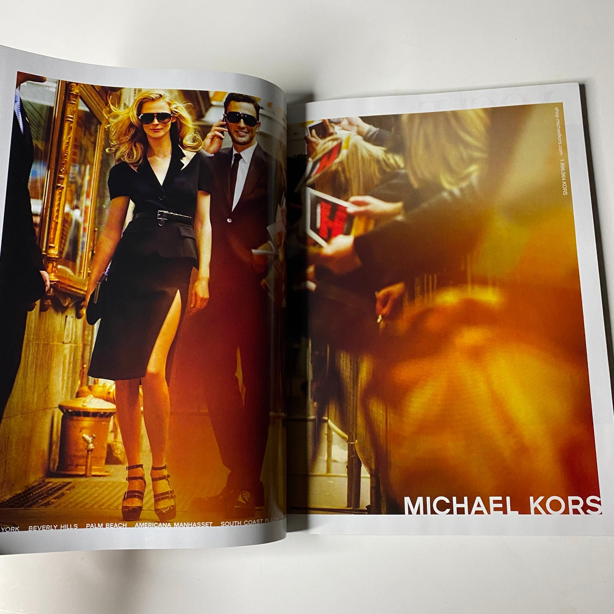 Open spread from Vogue Magazine August 2009 featuring a stylish image of a model wearing a black dress by Michael Kors, emphasizing the magazine's fashion insights.