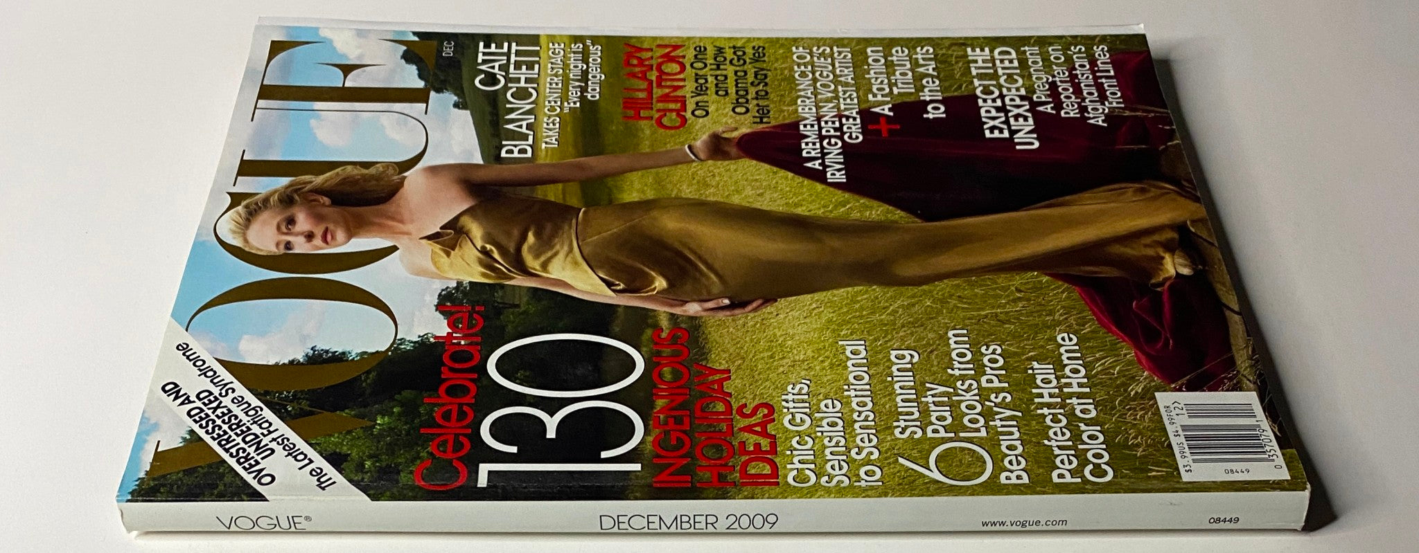 Vogue Magazine December 2009 cover displaying Cate Blanchett in a stunning gold gown, focusing on holiday fashion trends and highlighted stories for the festive season.