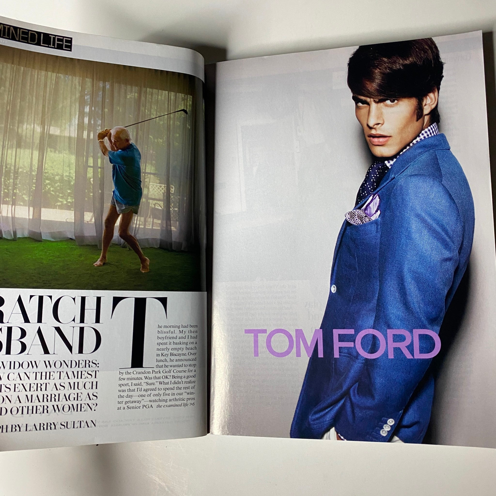 A stylish feature from the April 2009 Vogue magazine displaying Tom Ford in a suit, promoting high fashion and contemporary men's styles, alongside a feature on modern interior life.