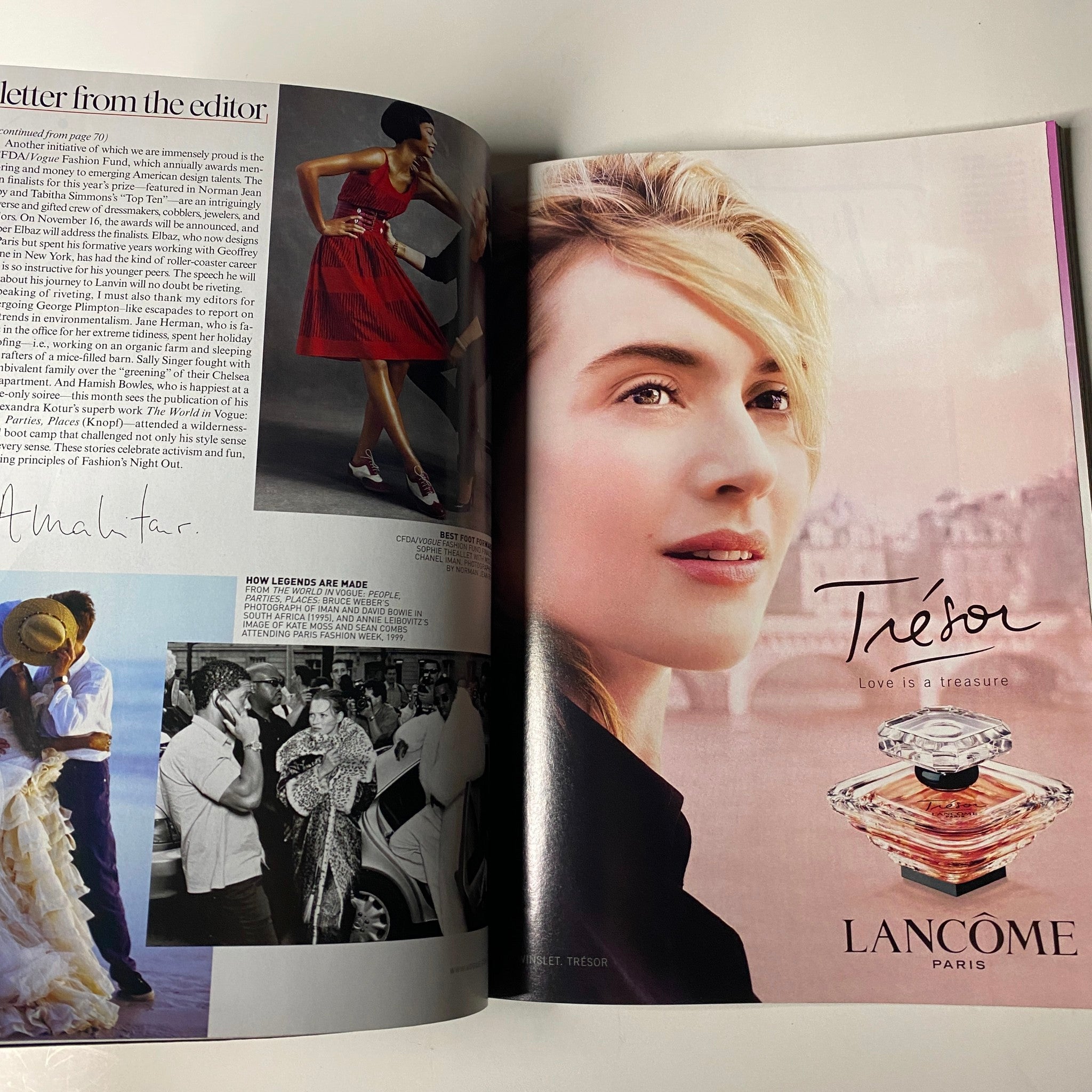 Vogue Magazine November 2009 showcasing a Lancôme advertisement with a model promoting Tresor perfume. Notable for its vibrant imagery in a culturally rich issue featuring Nicole Kidman and Marion Cotillard.