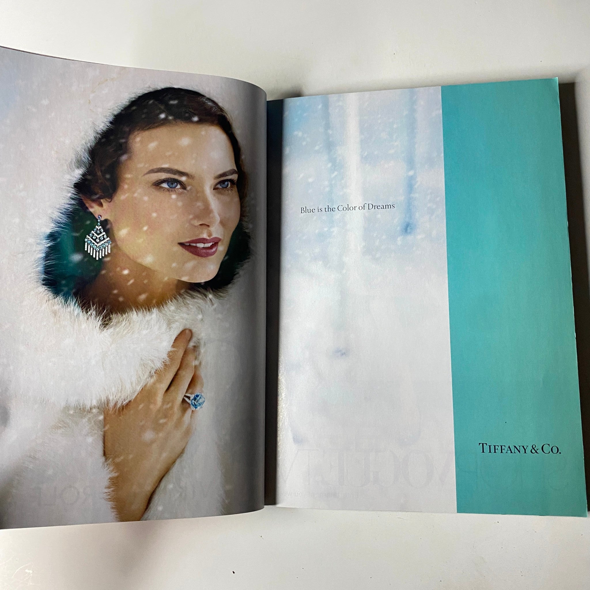 Vogue Magazine December 2007 Penelope Cruz Cover No Label VG - An advertisement spread showcasing an elegant model wearing fur and jewelry, representing a luxurious winter aesthetic.