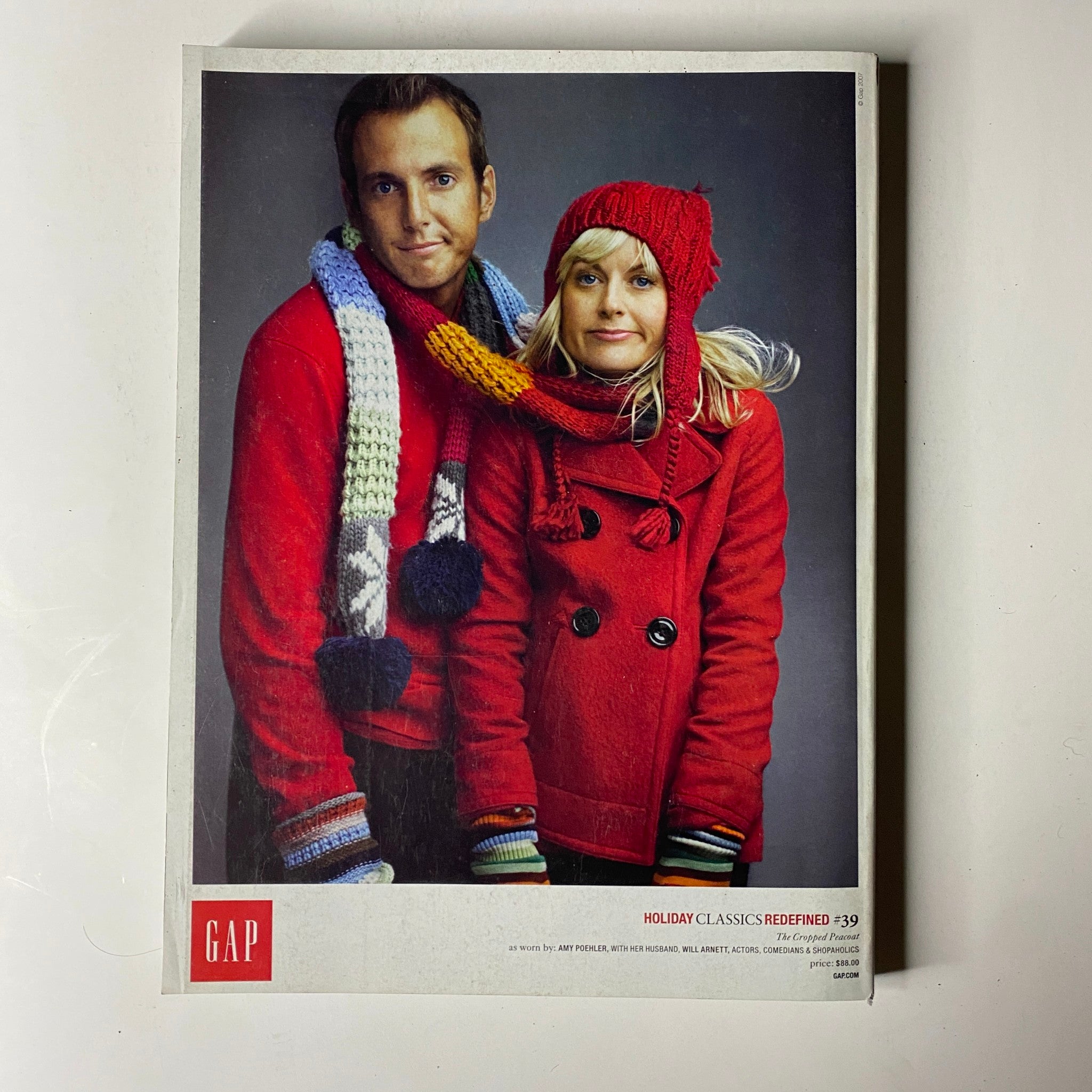 Vogue Magazine December 2007 Penelope Cruz Cover No Label VG - A cozy fashion advertisement featuring a couple in winter attire, promoting holiday style and seasonal warmth.