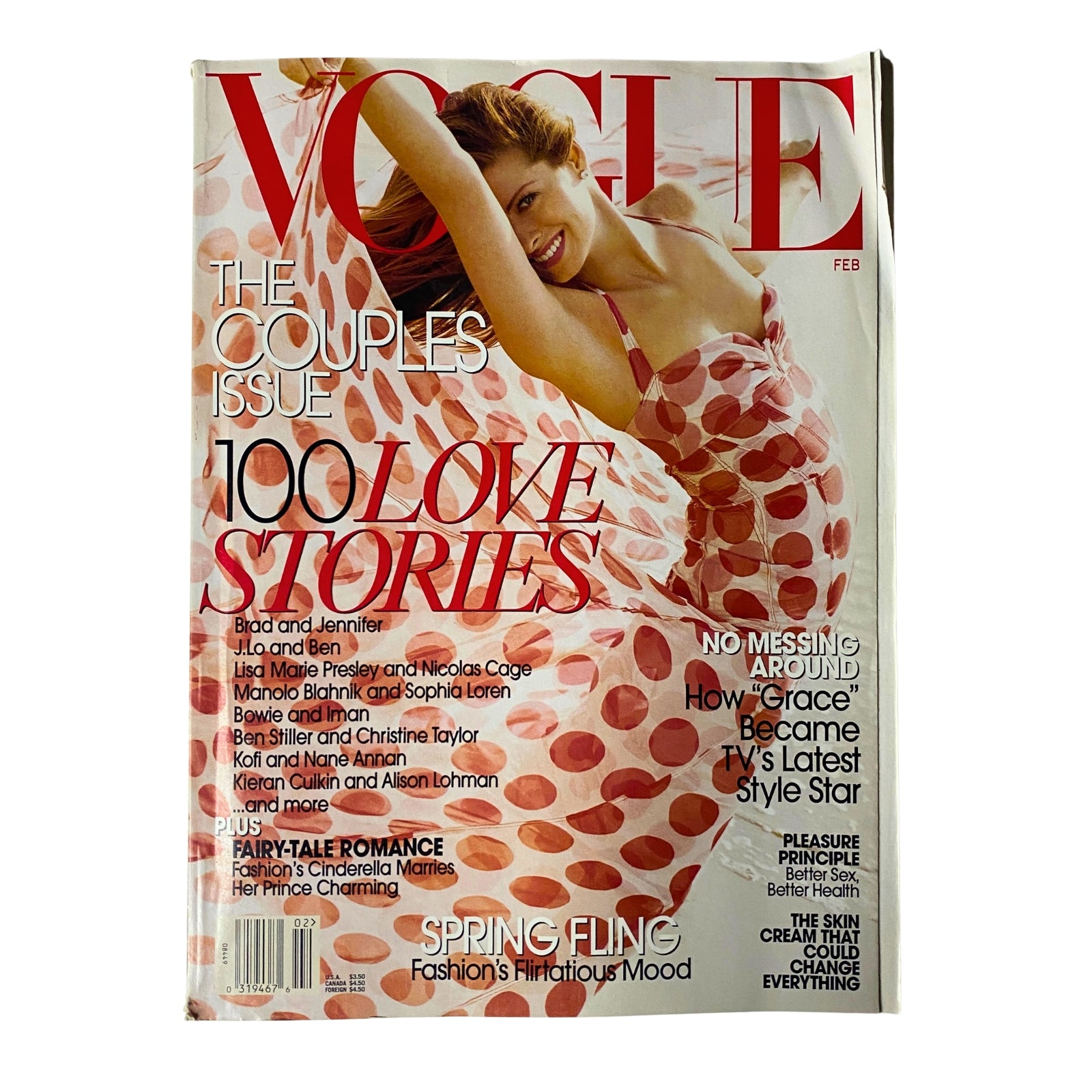 Vogue Magazine February 2003 featuring Debra Messing on the cover, celebrating her role in Will & Grace with a colorful design highlighting love stories.