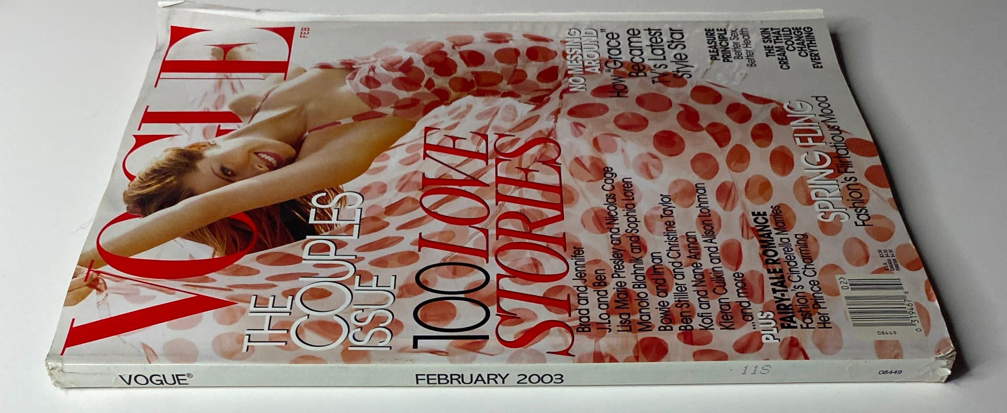 Side view of Vogue Magazine February 2003 with Debra Messing on the cover, showcasing its stylish cover design and details related to love and romance.