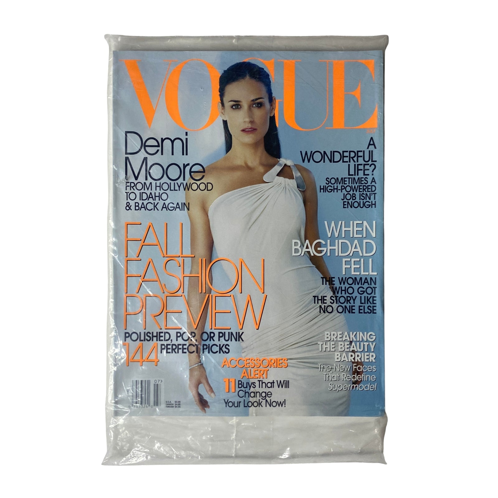 Vogue Magazine July 2003 Demi Moore Cover No Label New / Sealed, featuring a fashion-forward image of Demi Moore, showcasing the magazine's elegant design and pristine condition.