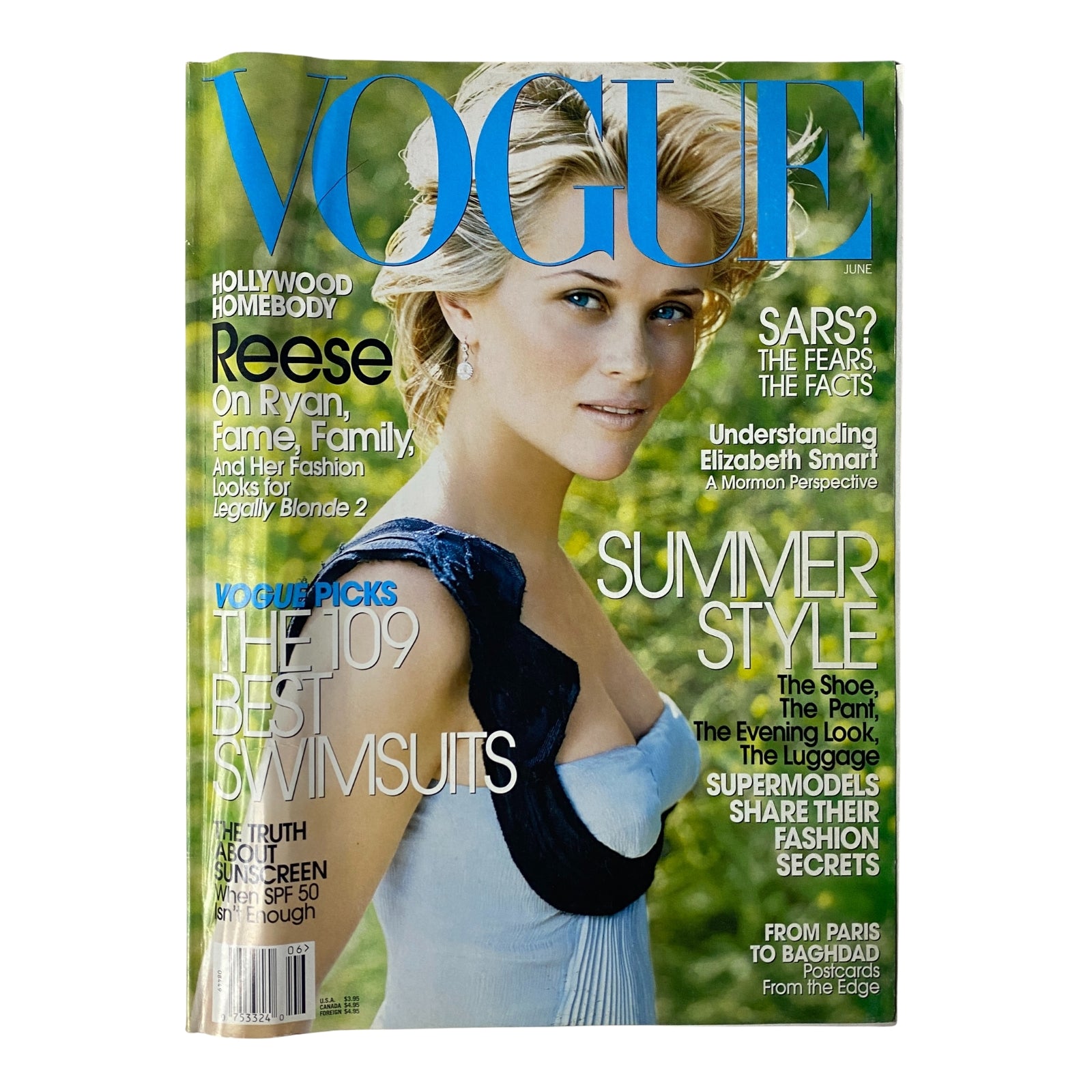 Vogue Magazine June 2003 cover featuring Reese Witherspoon showcasing summer style and swimsuit picks, emphasizing her Hollywood charm.