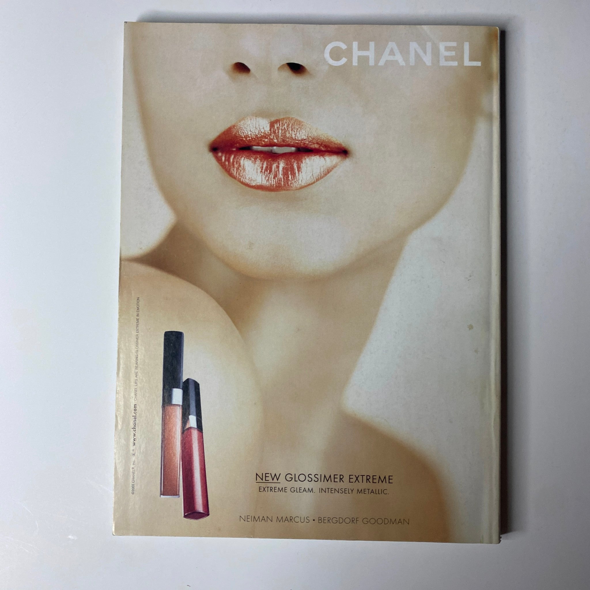 Chanel beauty advertisement highlighting New Glossimer Extreme lip gloss products, from Vogue Magazine June 2003 Reese Witherspoon Cover No Label.
