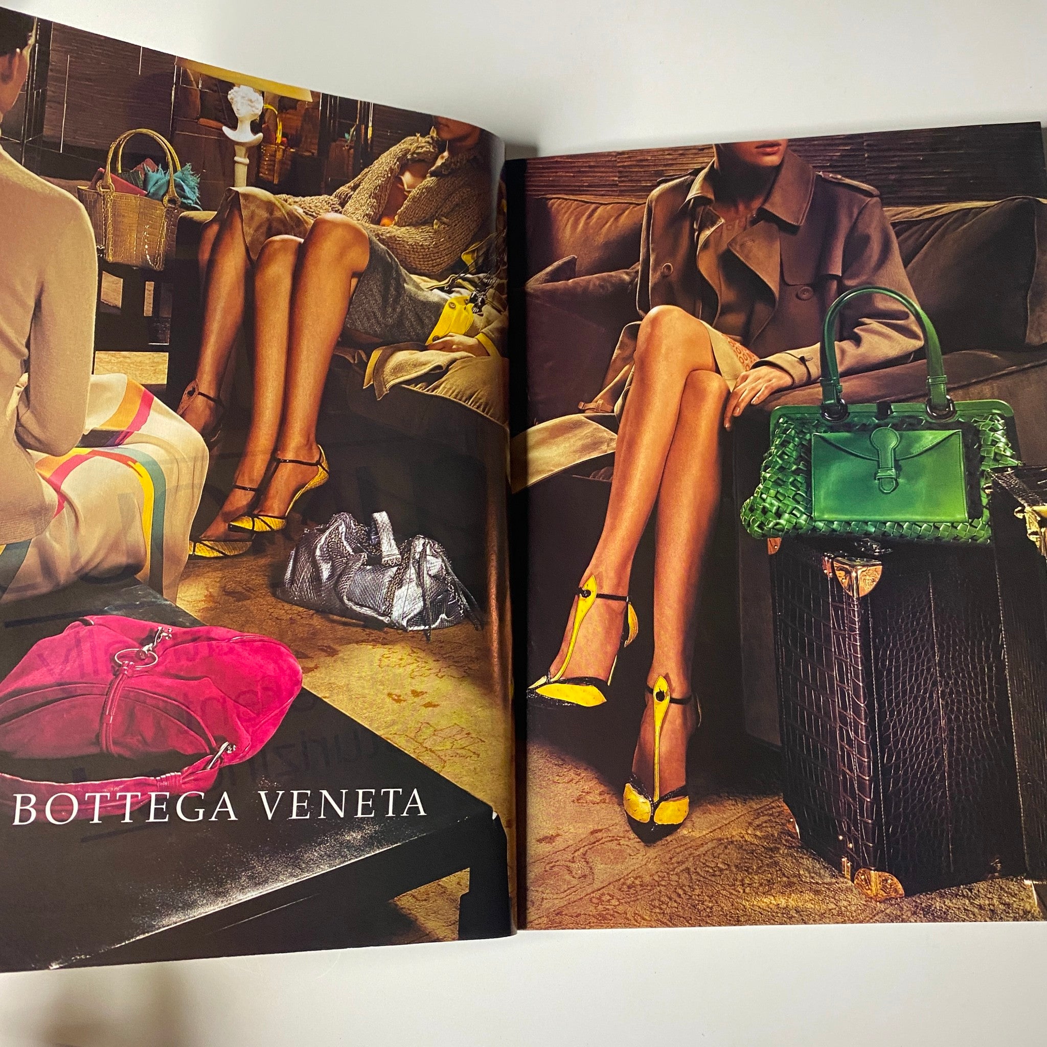 Vogue Magazine August 2004 spread highlighting Bottega Veneta fashion with models showcasing luxurious handbags and chic outfits, emphasizing high-fashion aesthetics.