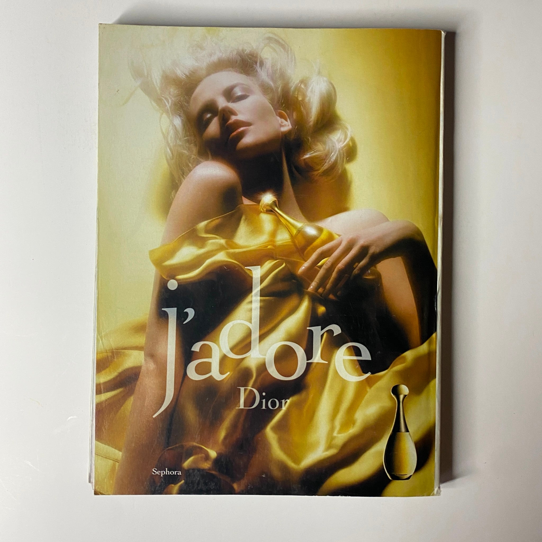 Ad campaign for J'adore Dior showcased in Vogue Magazine October 2004 Charlize Theron Cover No Label VG, highlighting luxury beauty and fashion.
