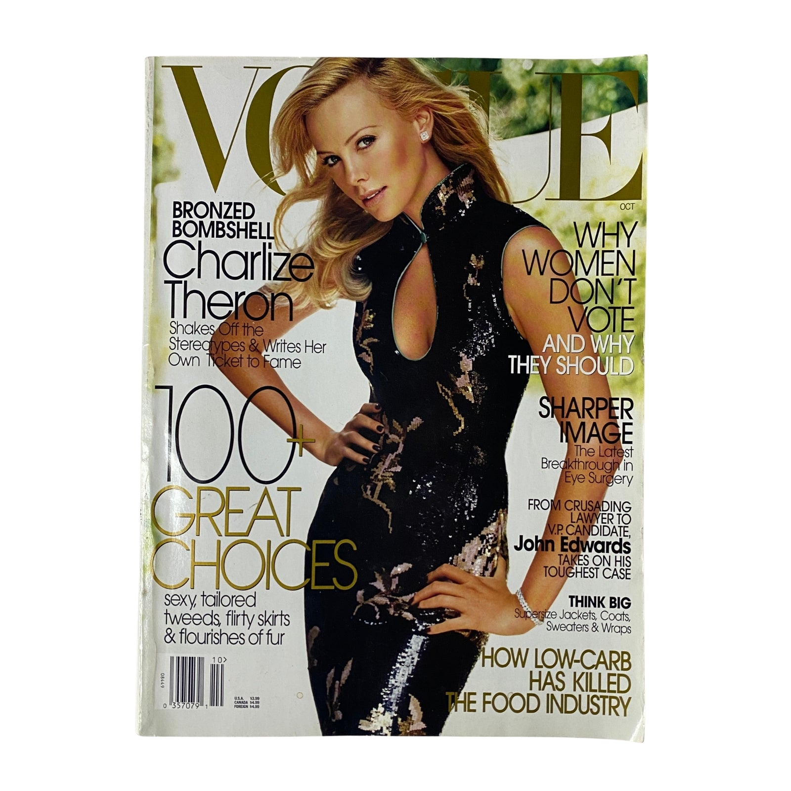 Vogue Magazine October 2004 cover featuring actress Charlize Theron in a glamorous black and gold outfit, highlighting her Oscar-winning role and fashion influence.