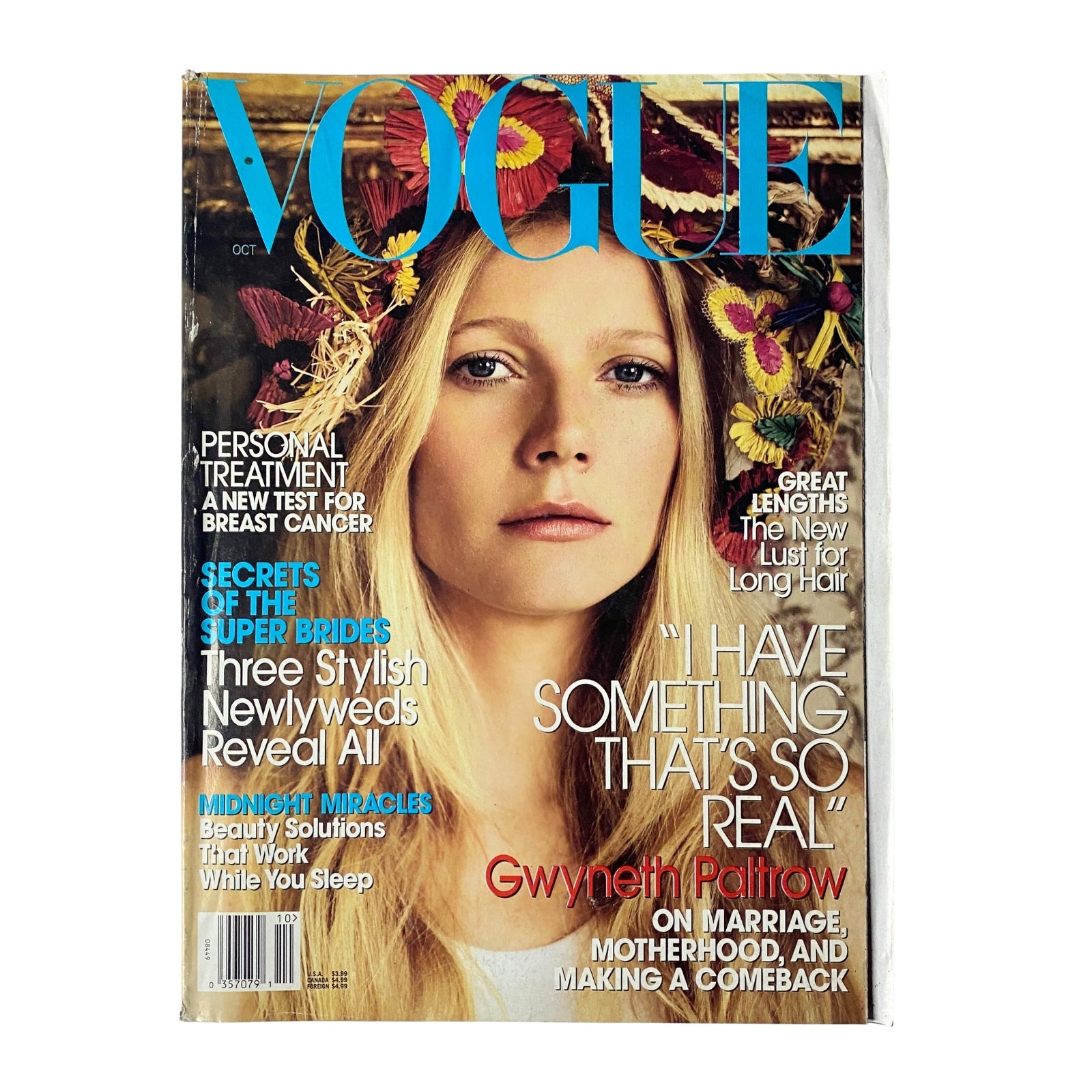 Vogue Magazine October 2005 cover featuring Gwyneth Paltrow with a radiant expression surrounded by floral decorations, highlighted by the title 'VOGUE'. This issue is known for its in-depth feature on fashion and personal beauty.