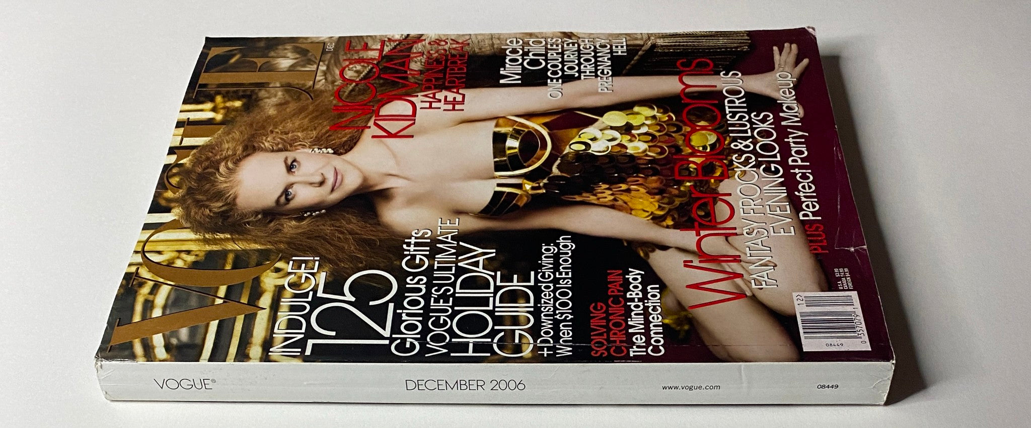 Side view of Vogue Magazine December 2006, featuring Nicole Kidman on the cover, highlighting luxury fashion, holiday themes, and exclusive content.