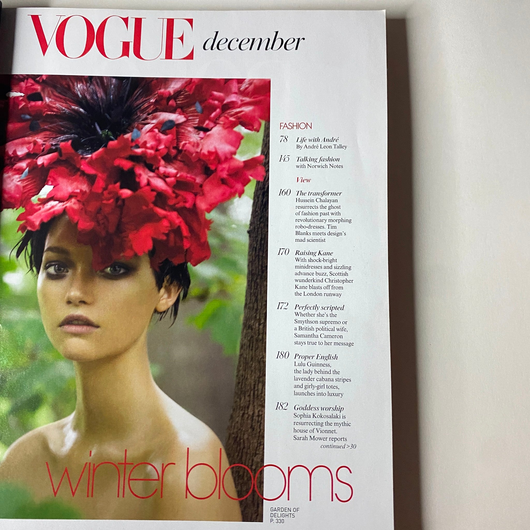 Interior page of Vogue Magazine December 2006 showcasing the fashion section titled 'Winter Blooms', highlighting a floral-themed editorial mix.