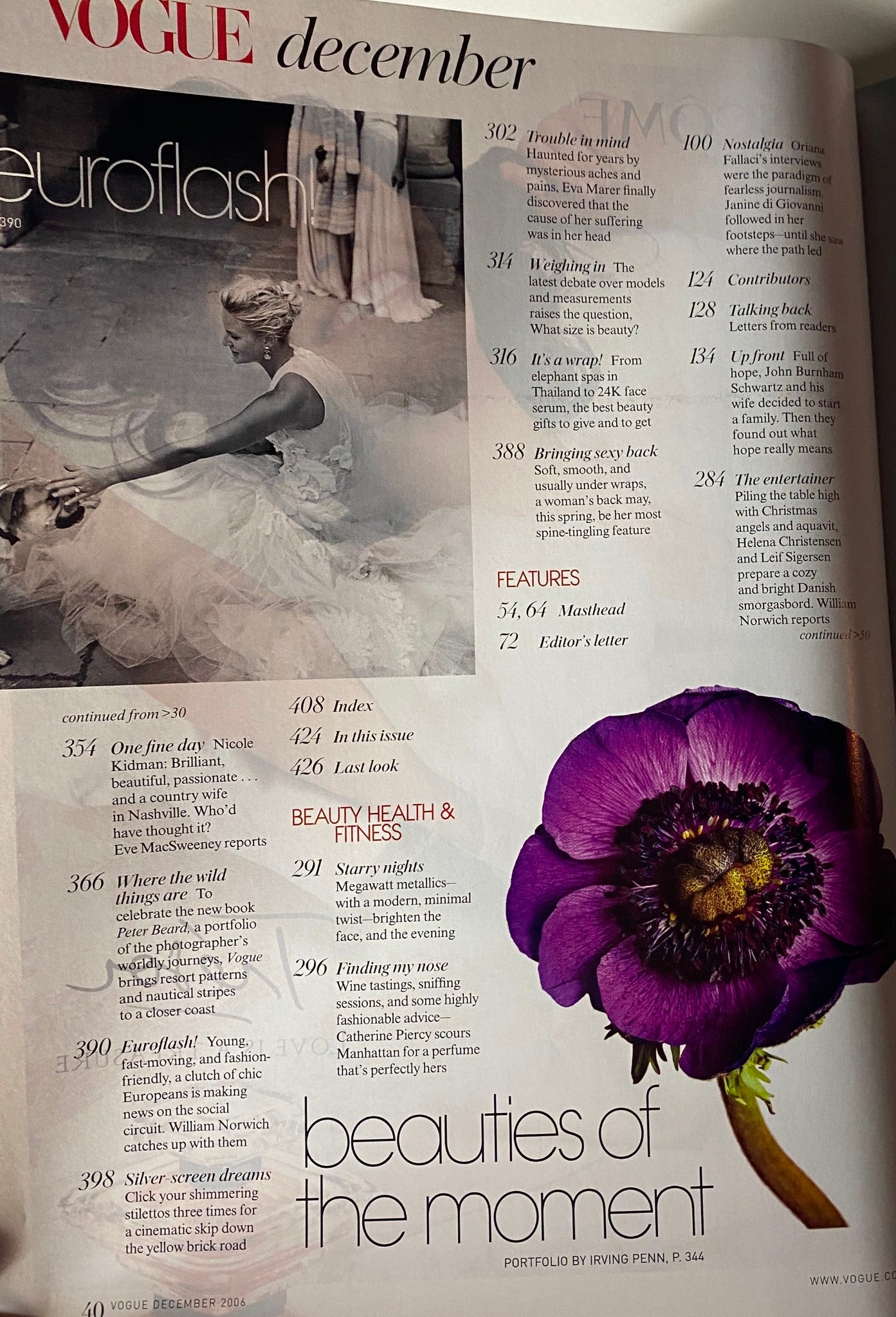 Interior page of Vogue Magazine December 2006 displaying artistic photography and floral design, connecting beauty with the season's fashion themes.