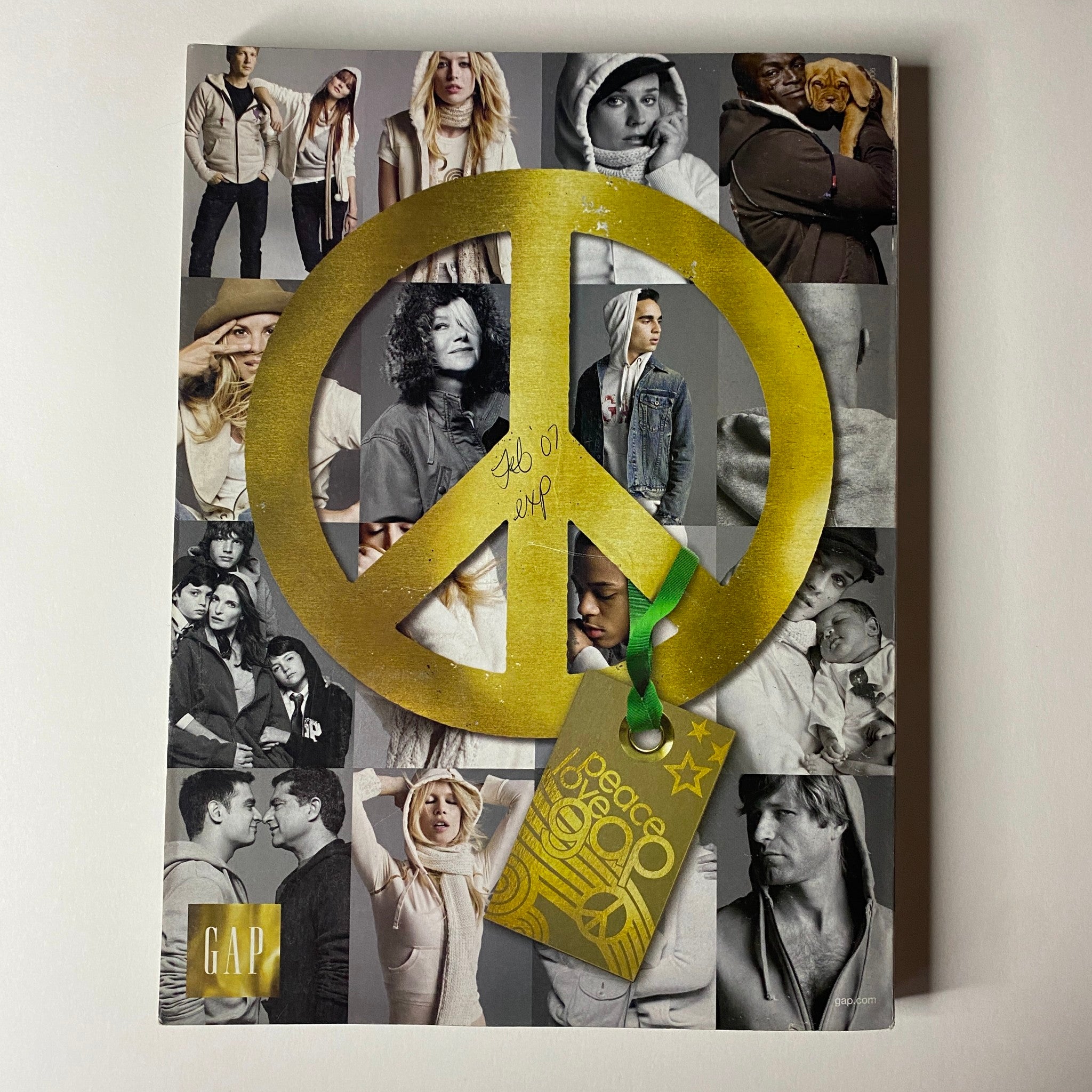Cover of GAP Peace catalog from 2007, featuring a large peace sign surrounded by diverse models in casual clothing. This image is an engaging complement to the Nicole Kidman cover of Vogue Magazine December 2006.