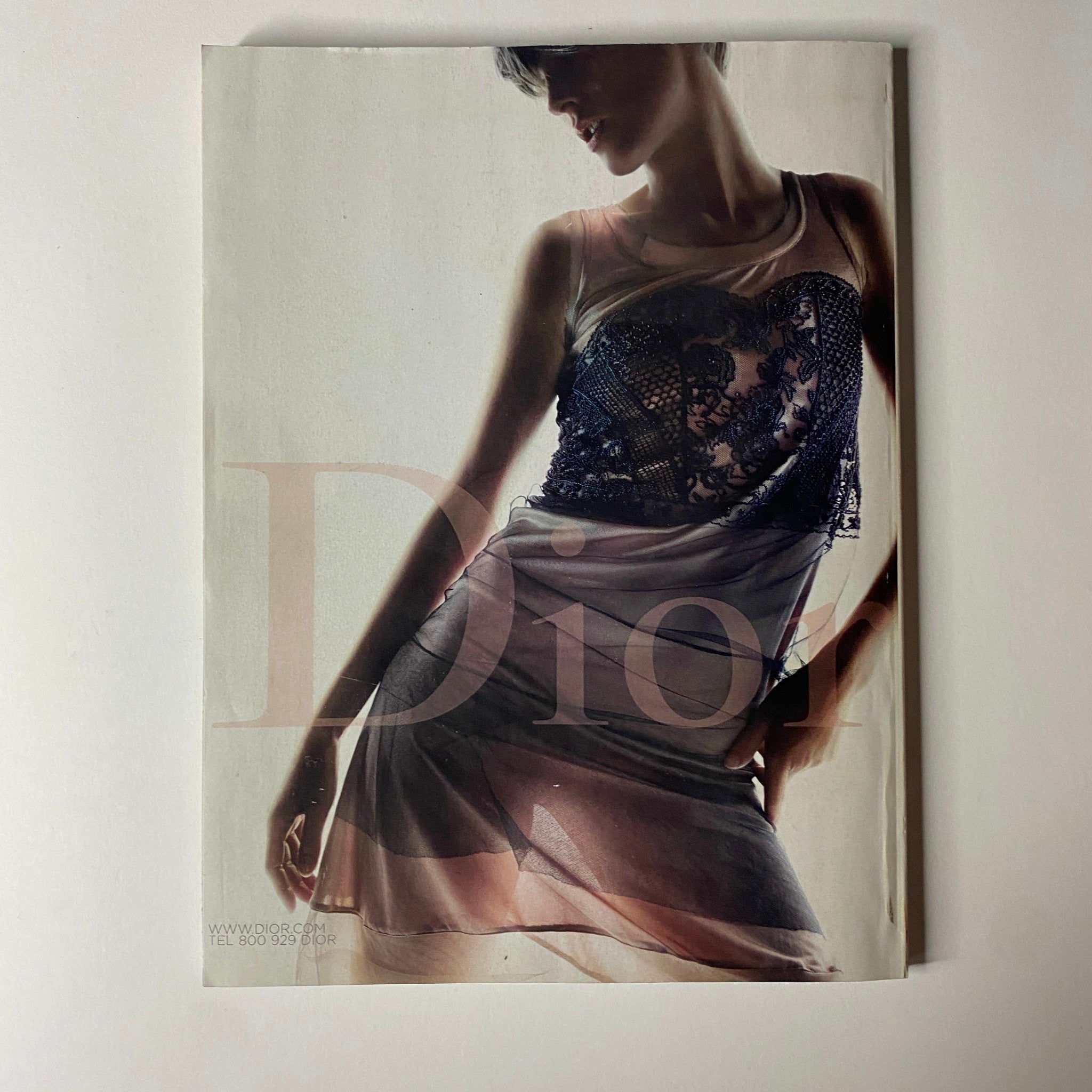 Vogue Magazine February 2006 Drew Barrymore Cover - A fashion editorial featuring a model wearing a Dior dress, showcasing contemporary style and elegance.