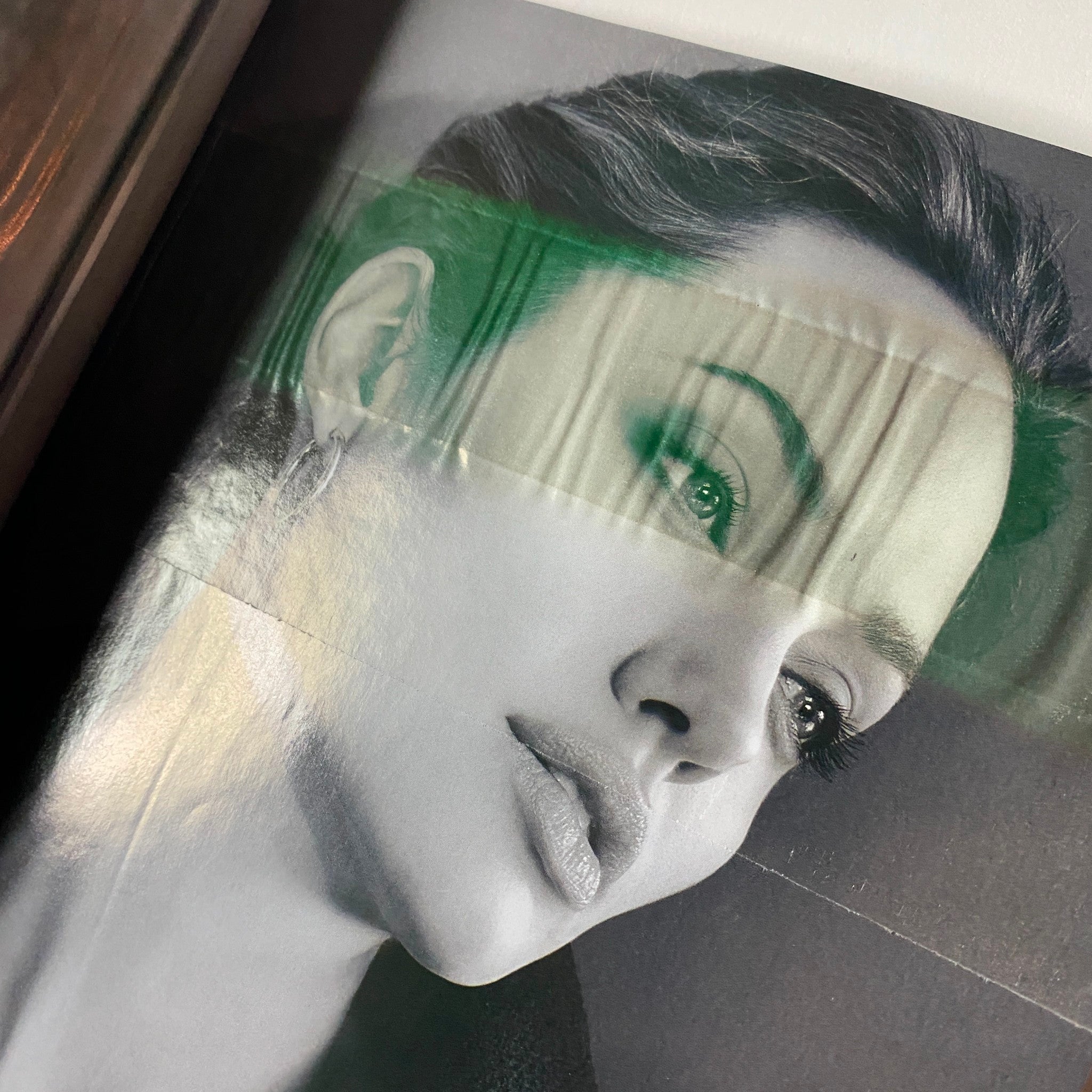 Vogue Magazine February 2006 Drew Barrymore Cover - A close-up portrait of a striking model, captured in black and white, highlighting beauty and sophistication in fashion photography.