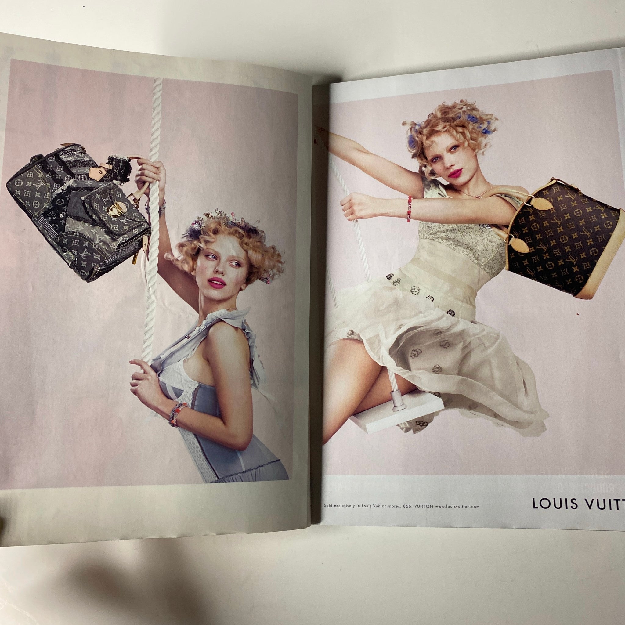 Double-page spread from Vogue Magazine February 2007 featuring a fashion editorial with models showcasing luxury handbags.