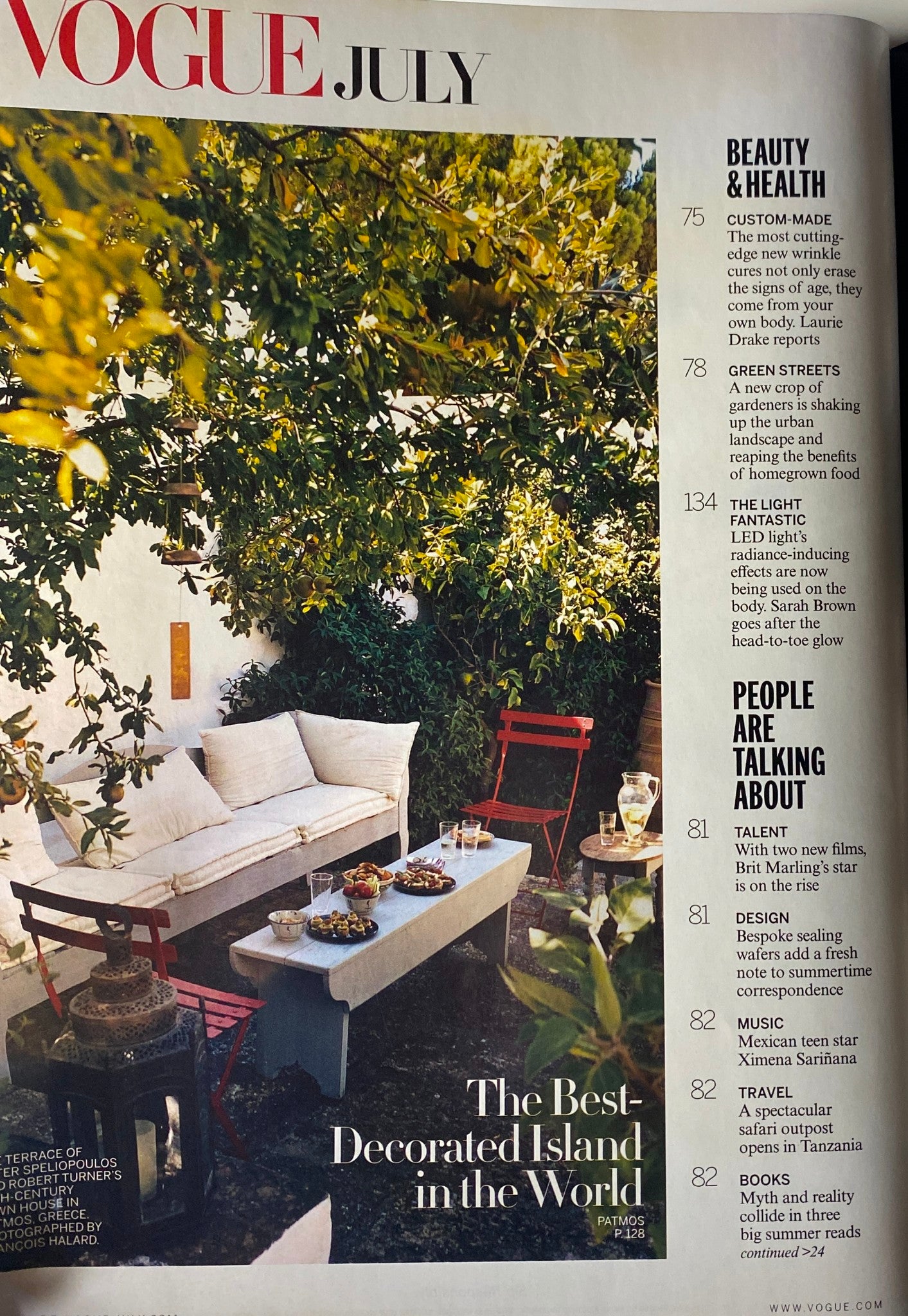 Inside page of Vogue Magazine July 2011 featuring a lifestyle section titled 'The Best-Decorated Island in the World', complementing the stylish editorial by Emma Watson.