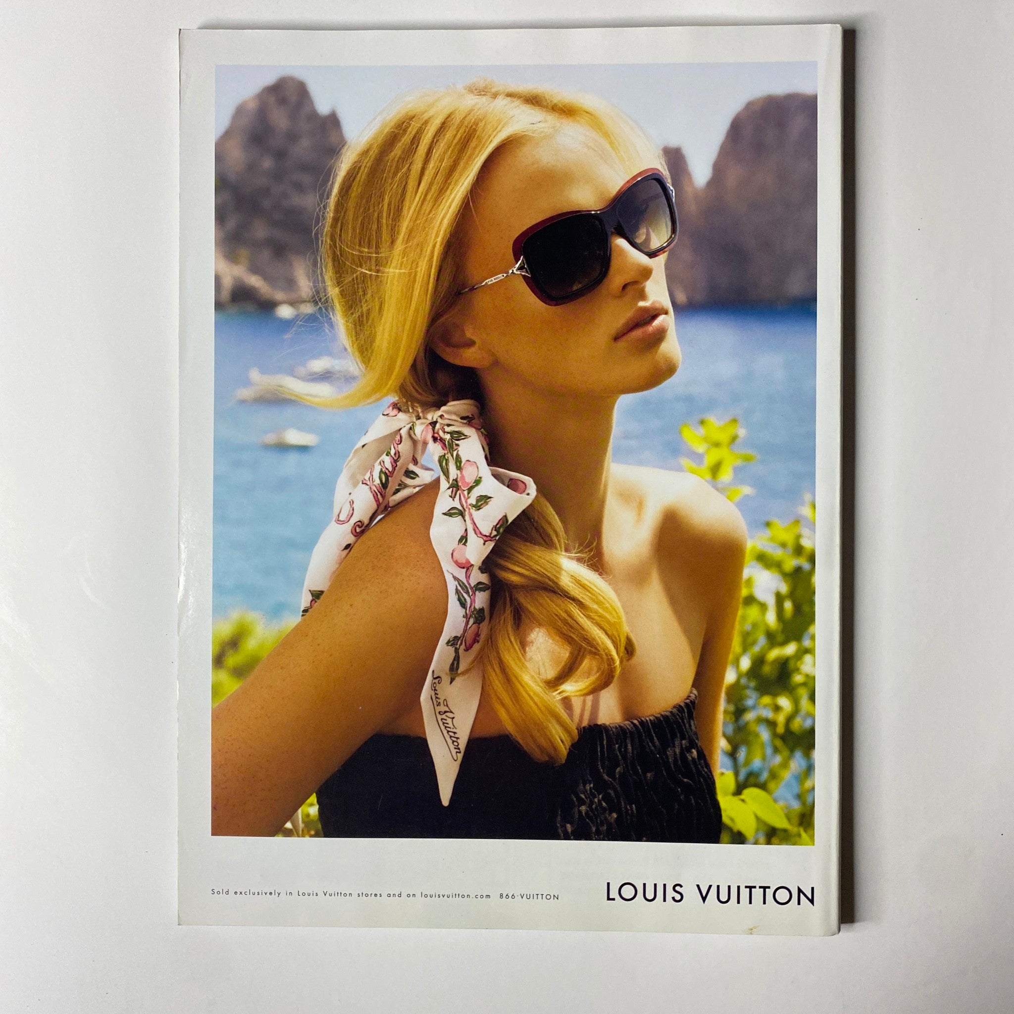 Vogue Magazine July 2011 Emma Watson Cover No Label VG featuring a stylish model in a Louis Vuitton ad, wearing sunglasses and a scarf against a scenic ocean backdrop.