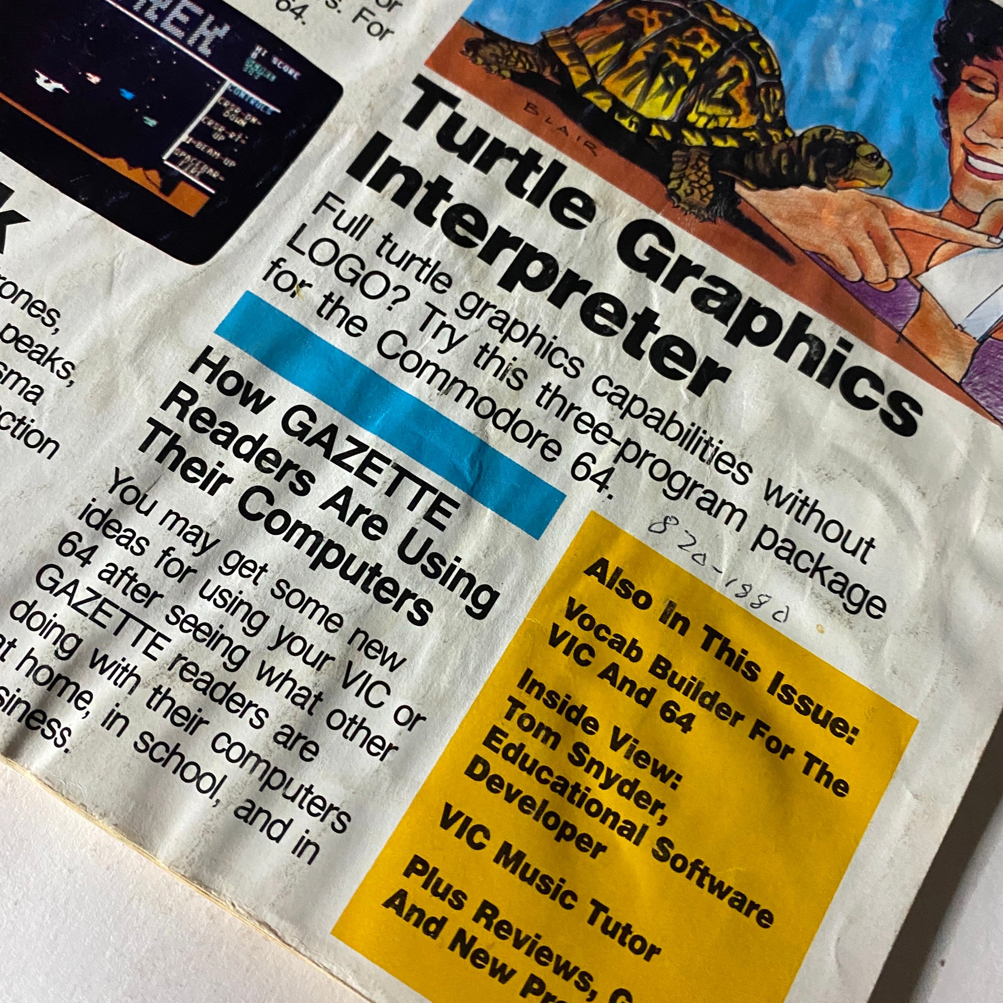 Close-up of Compute Gazette Magazine October 1984 highlighting the Turtle Graphics Interpreter and section on how readers use their Commodore 64 computers. Essential vintage tech magazine for collectors.