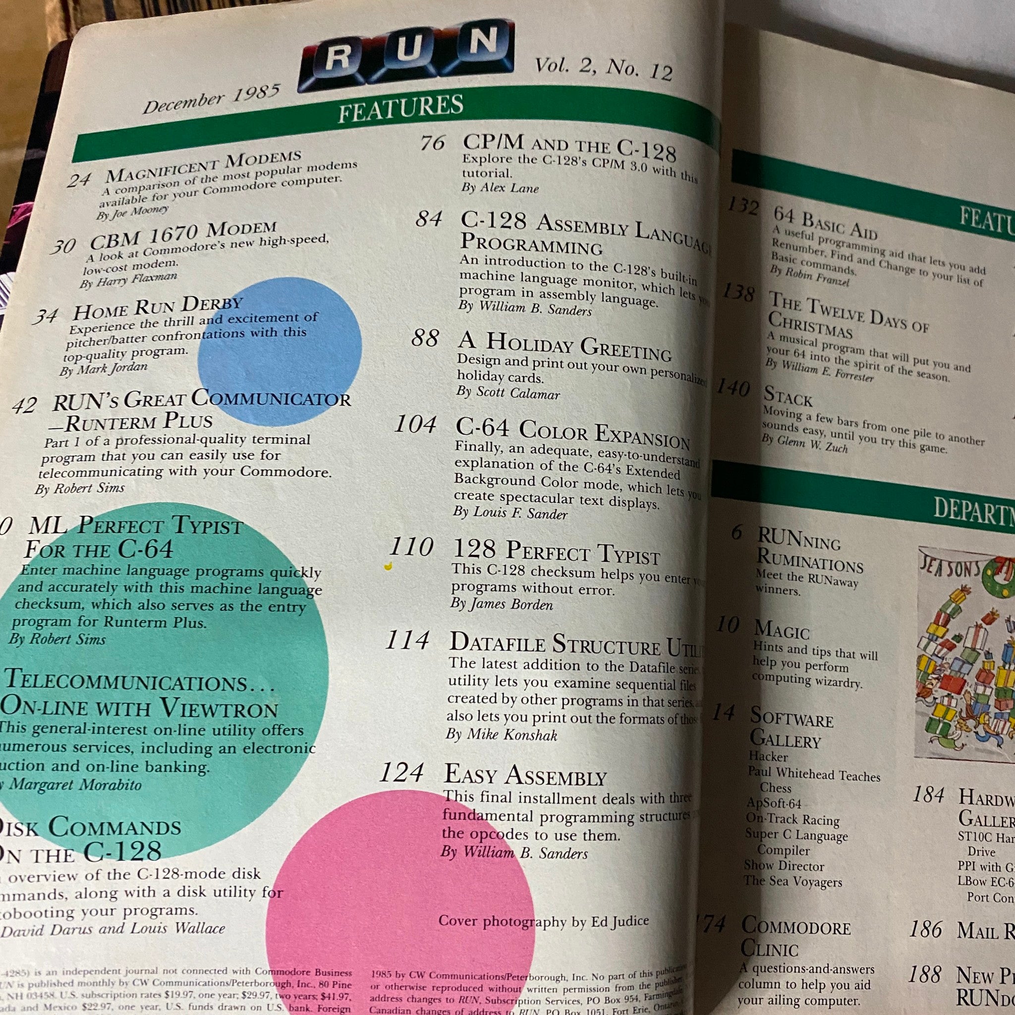 Inside spread of VTG Run Magazine December 1985 Software Shoppers' Guide, showcasing various features including programming help for Commodore C-128 users.