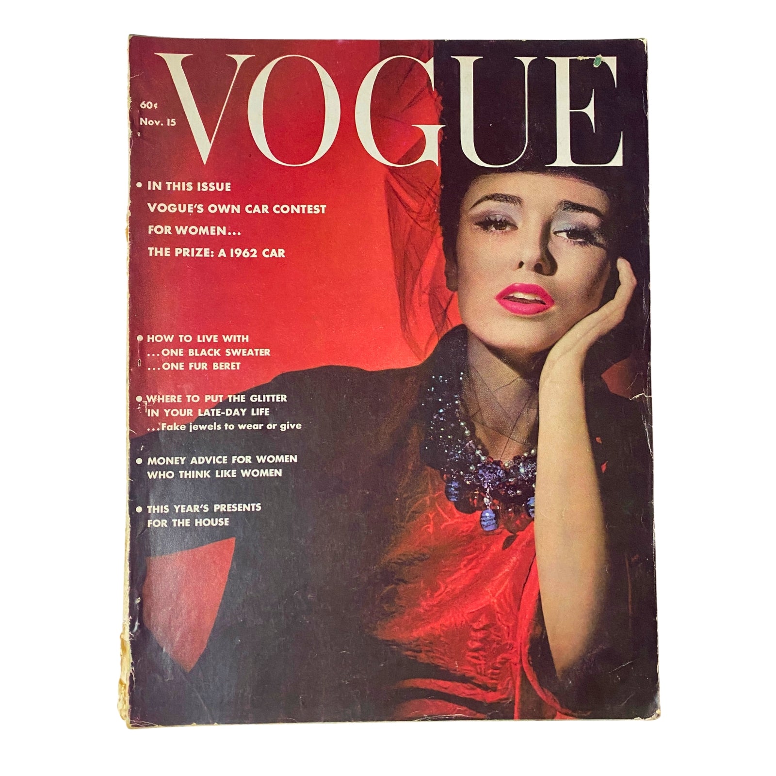 Vogue Magazine November 15, 1961 cover featuring a stunning model with glamorous red lipstick and statement jewelry, showcasing mid-century fashion.
