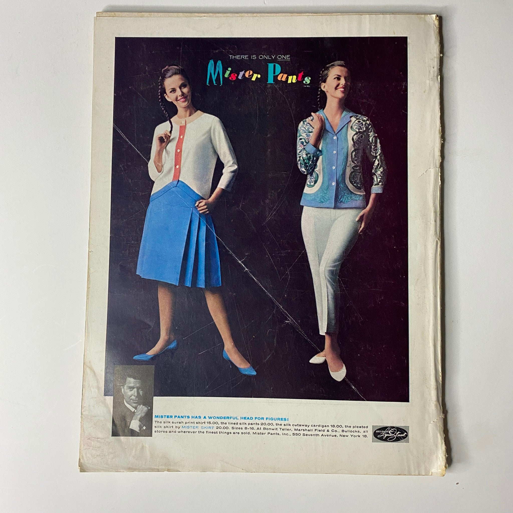 Vogue Magazine November 15, 1961 featuring a colorful advertisement for Mister Pant's fashion, showcasing stylish women's attire from the early 1960s including a cardigan and skirt ensemble, focusing on mid-century fashion aesthetics.