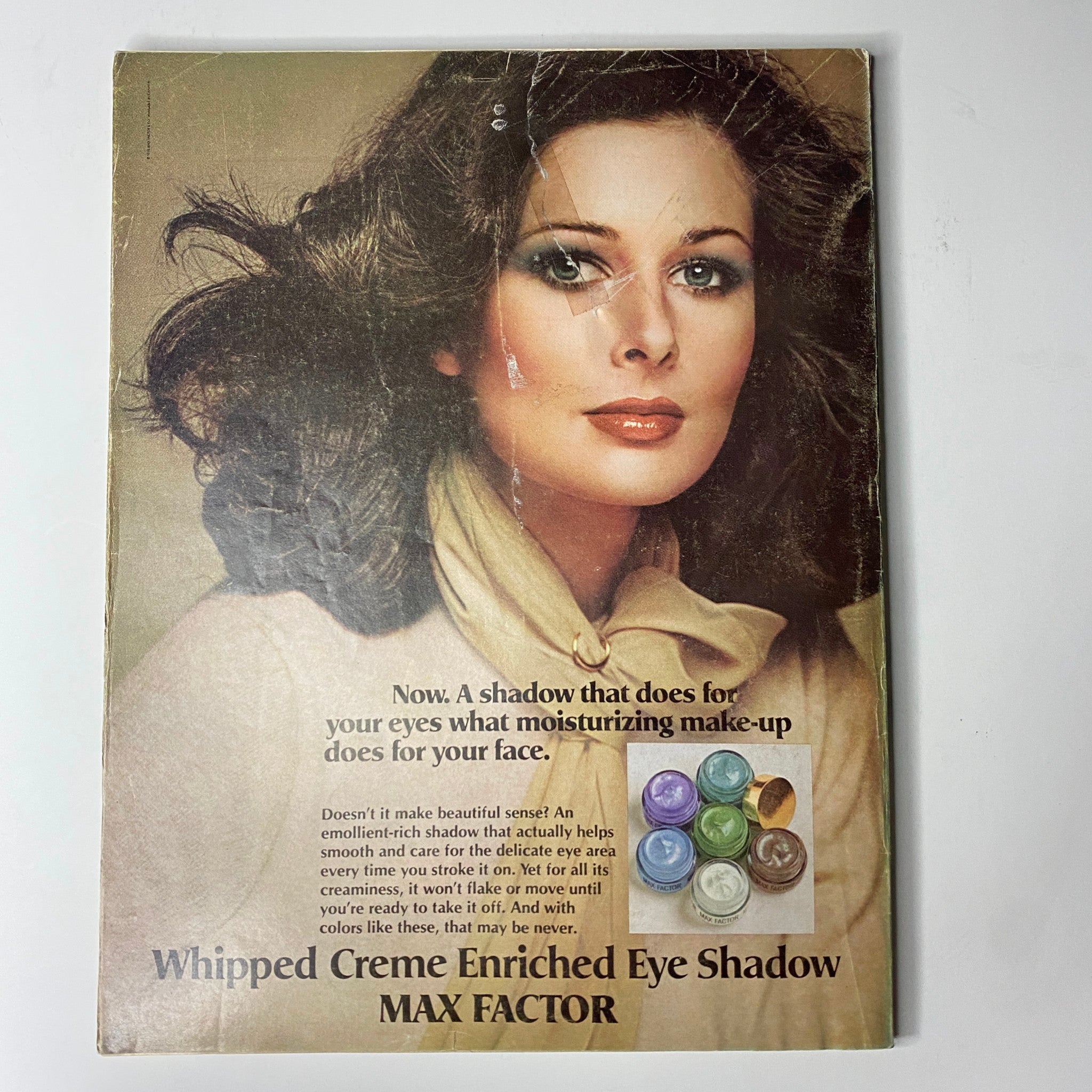 Cover of Vogue Magazine April 1975 featuring Cheryl Tiegs, showcasing vintage beauty and fashion from the 1970s. The magazine cover highlights the era's iconic style.