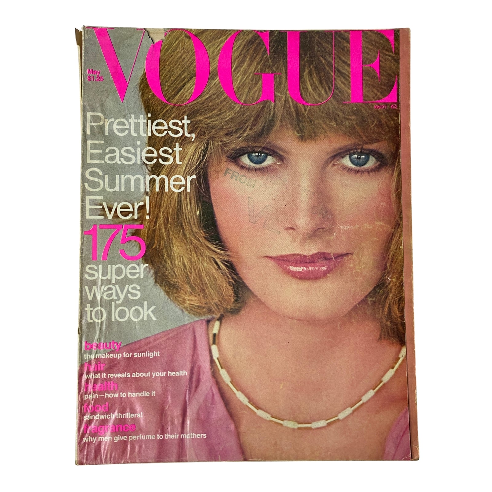 Vogue Magazine May 1976 Rene Russo Cover featuring bold pink lettering and a youthful model showcasing summer beauty tips.