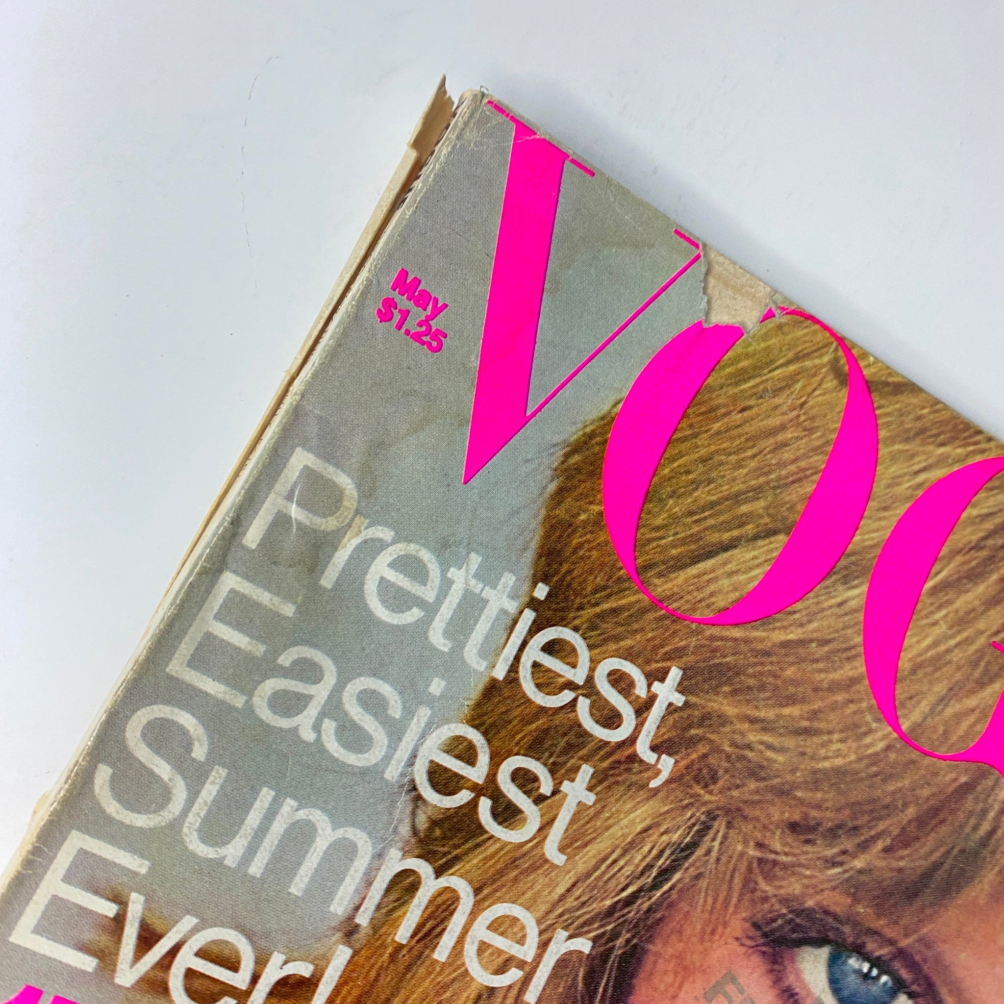 Close-up of the top corner of Vogue Magazine May 1976, highlighting the date and partial title emphasizing summer beauty.