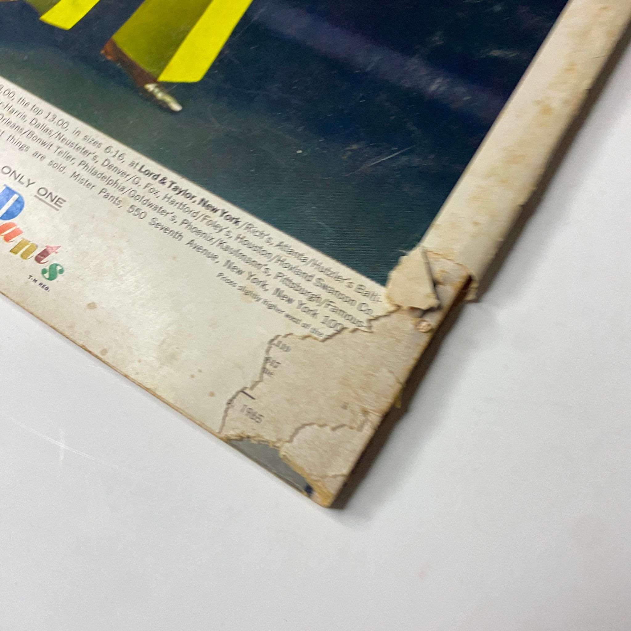 Detail shot of the back cover of Vogue Magazine – November 15, 1965 – showing wear and tear along with the advertisement for Mister Pants.