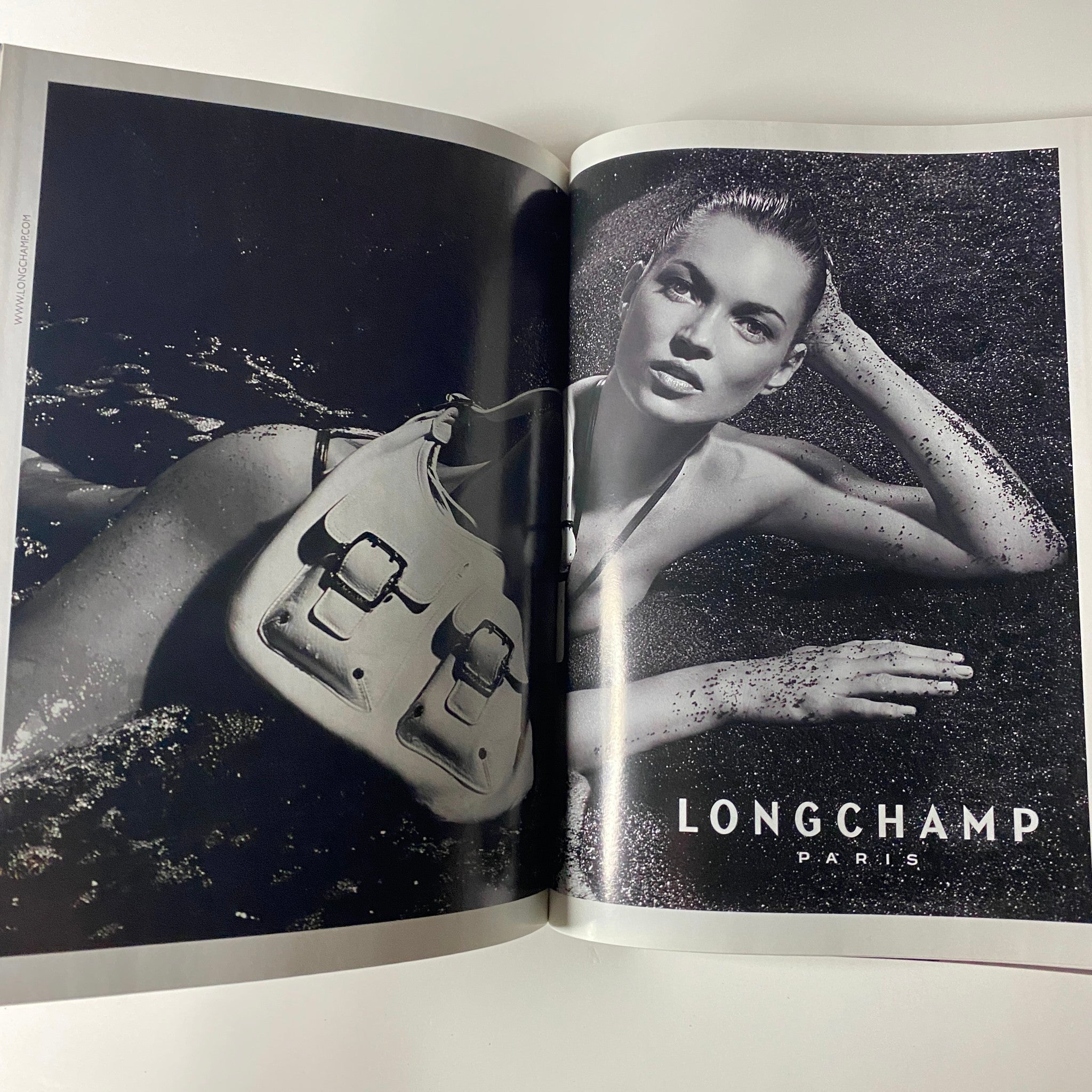 Spread from Vogue Magazine March 2007 showing an advertisement for Longchamp Paris, highlighting high-end fashion accessories.