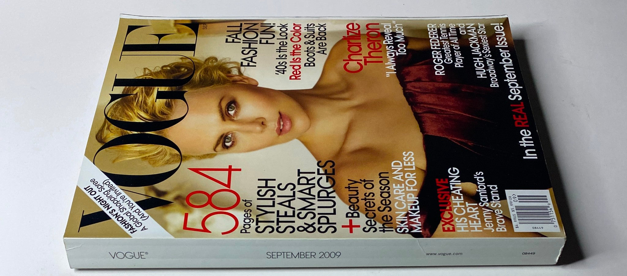 Side view of Vogue Magazine September 2009 with Charlize Theron on the cover, emphasizing articles on fashion, style, and exclusive profiles for the fall season.