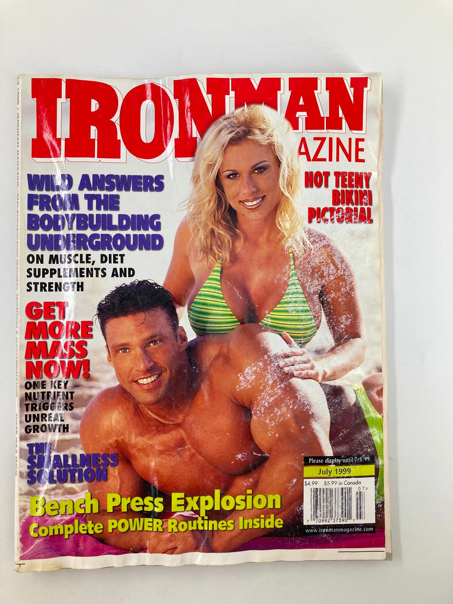 Cover of Ironman Magazine July 1999 featuring models Christina Hunter and Daniel Freeman. The magazine highlights fitness culture with bold headlines about bodybuilding, nutrition, and workout strategies.