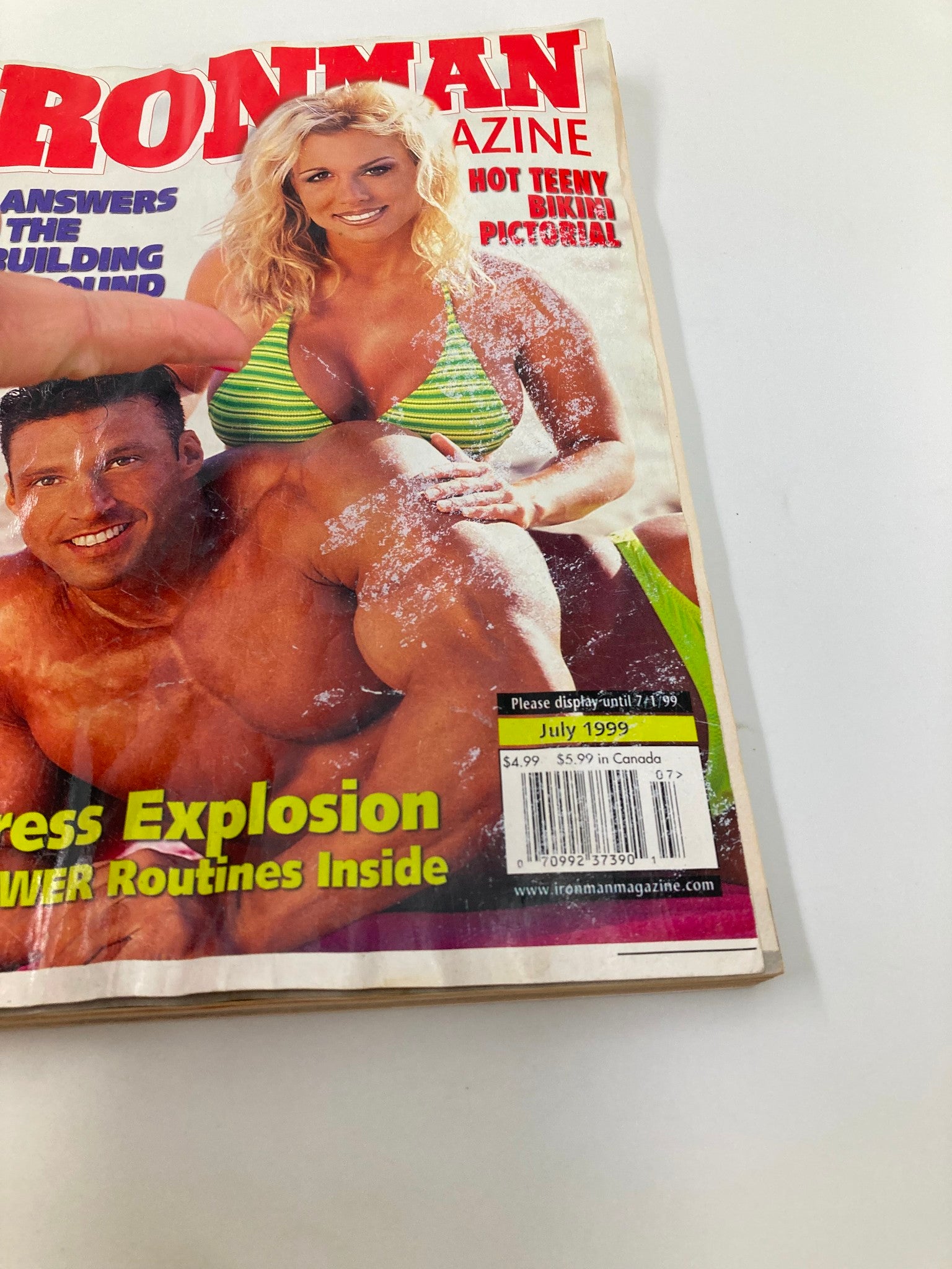 Detailed view of the cover of Ironman Magazine July 1999 showcasing Christina Hunter and Daniel Freeman, with magazine pricing and publication date.