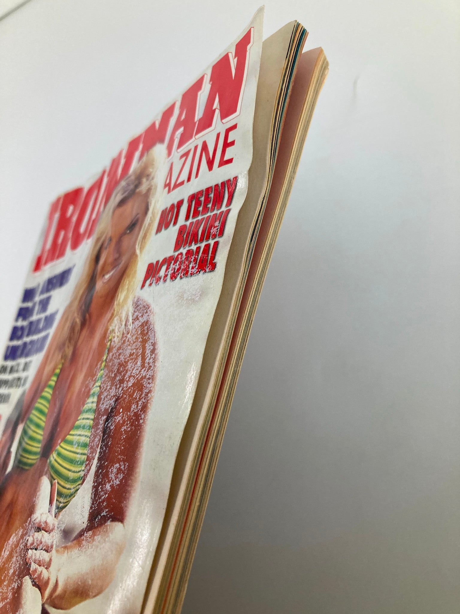 Side view of Ironman Magazine July 1999 displaying the spine and cover graphics of fitness icons Christina Hunter and Daniel Freeman.
