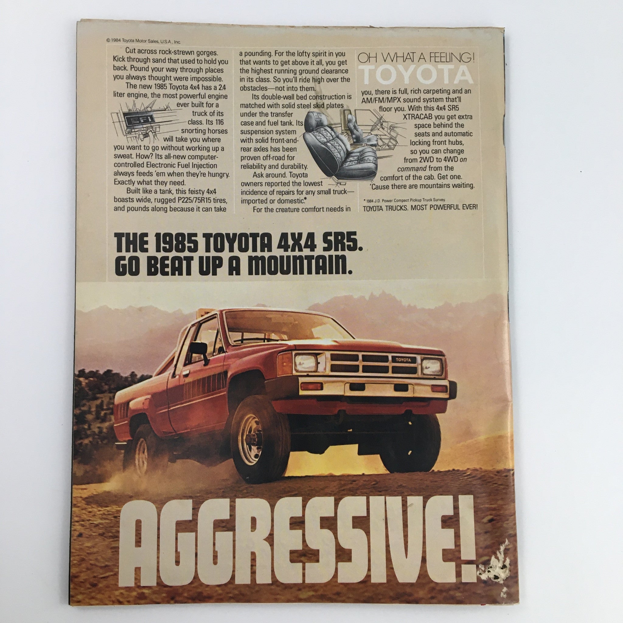 Vintage advertisement for the 1985 Toyota 4x4 SR5 featured in Sports Illustrated Magazine December 10 1984, showcasing its rugged design and capabilities.