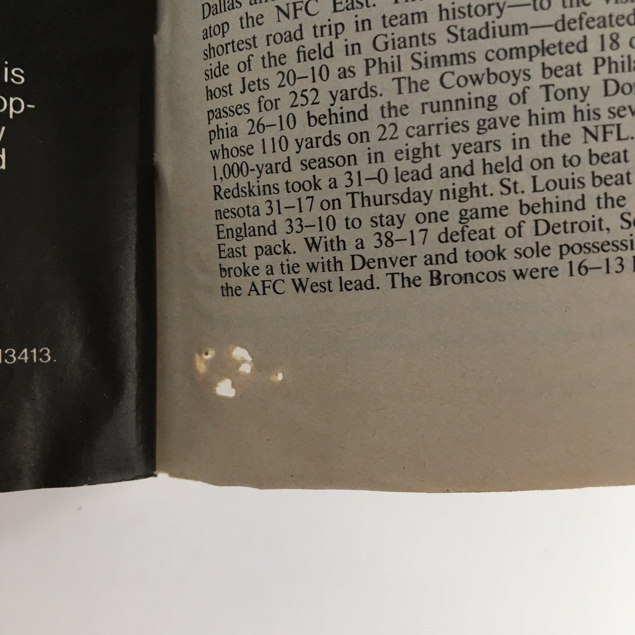 Wear details on the page of Sports Illustrated Magazine December 10 1984, showing some light marks and imperfections typical of older magazines.