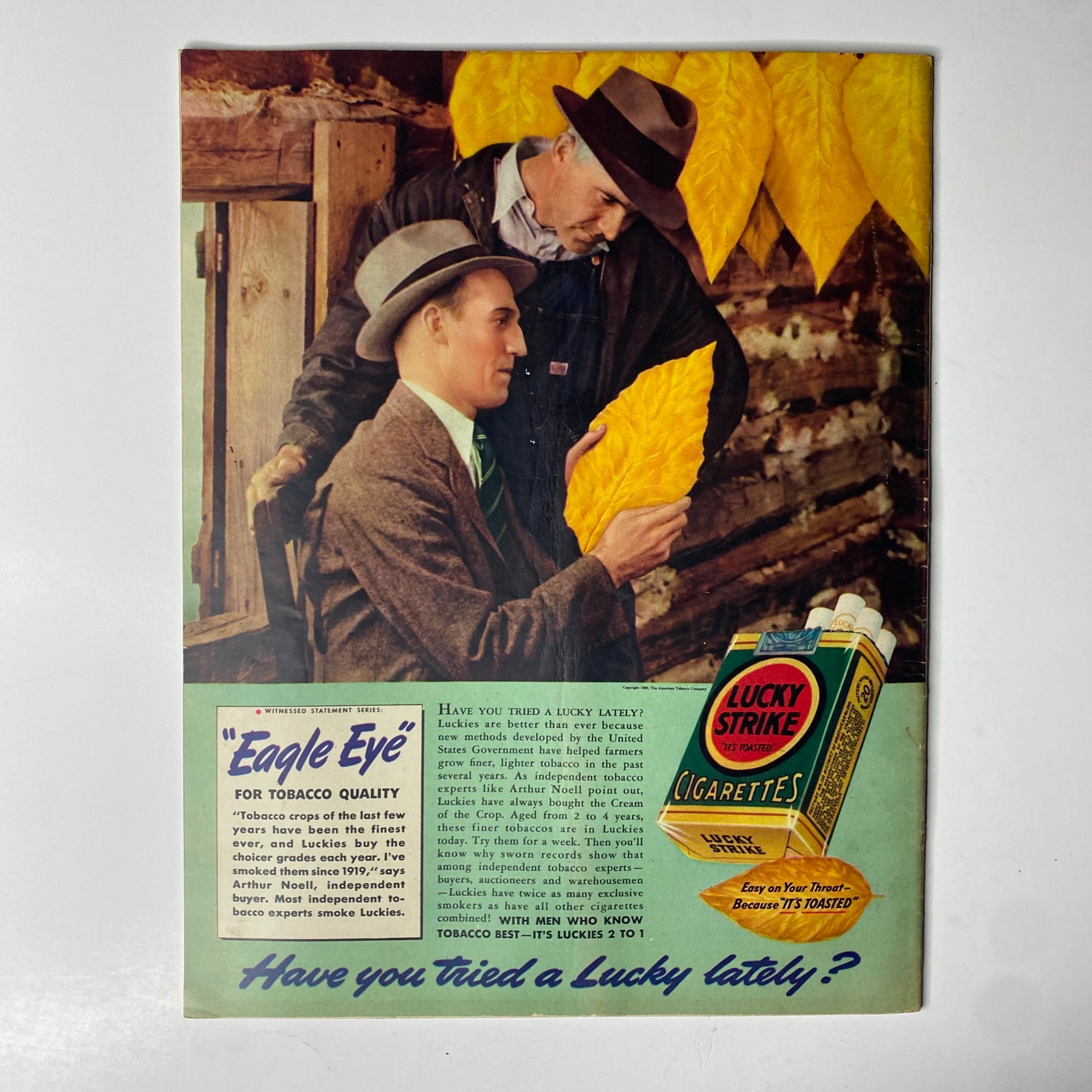 Advertisement for Lucky Strike cigarettes titled 'Eagle Eye' in Look Magazine, August 1, 1939, featuring two men handling tobacco leaves and promoting the quality of Lucky Strike cigarettes.